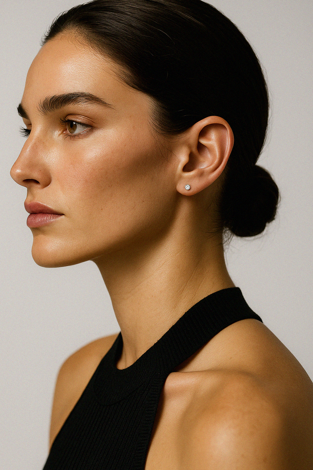 Earrings set with a 2.5 mm round cubic zirconia on 14k gold posts