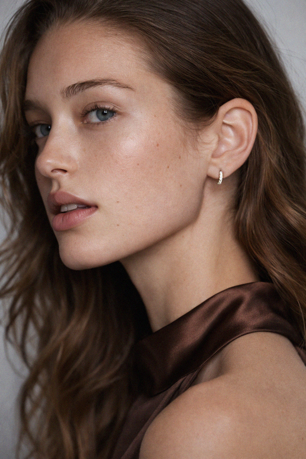 10k gold huggies earrings with cubic zirconia
