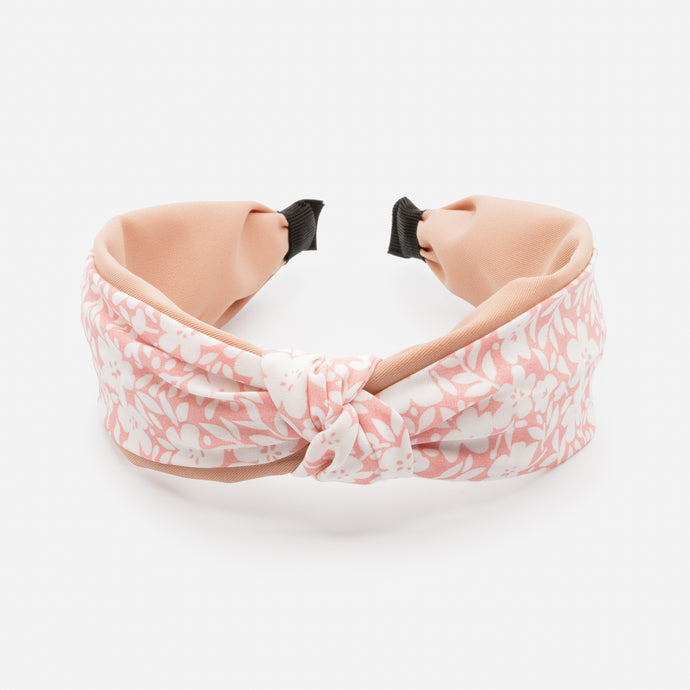 Bandeau rose avec noeud et fleurs blanches