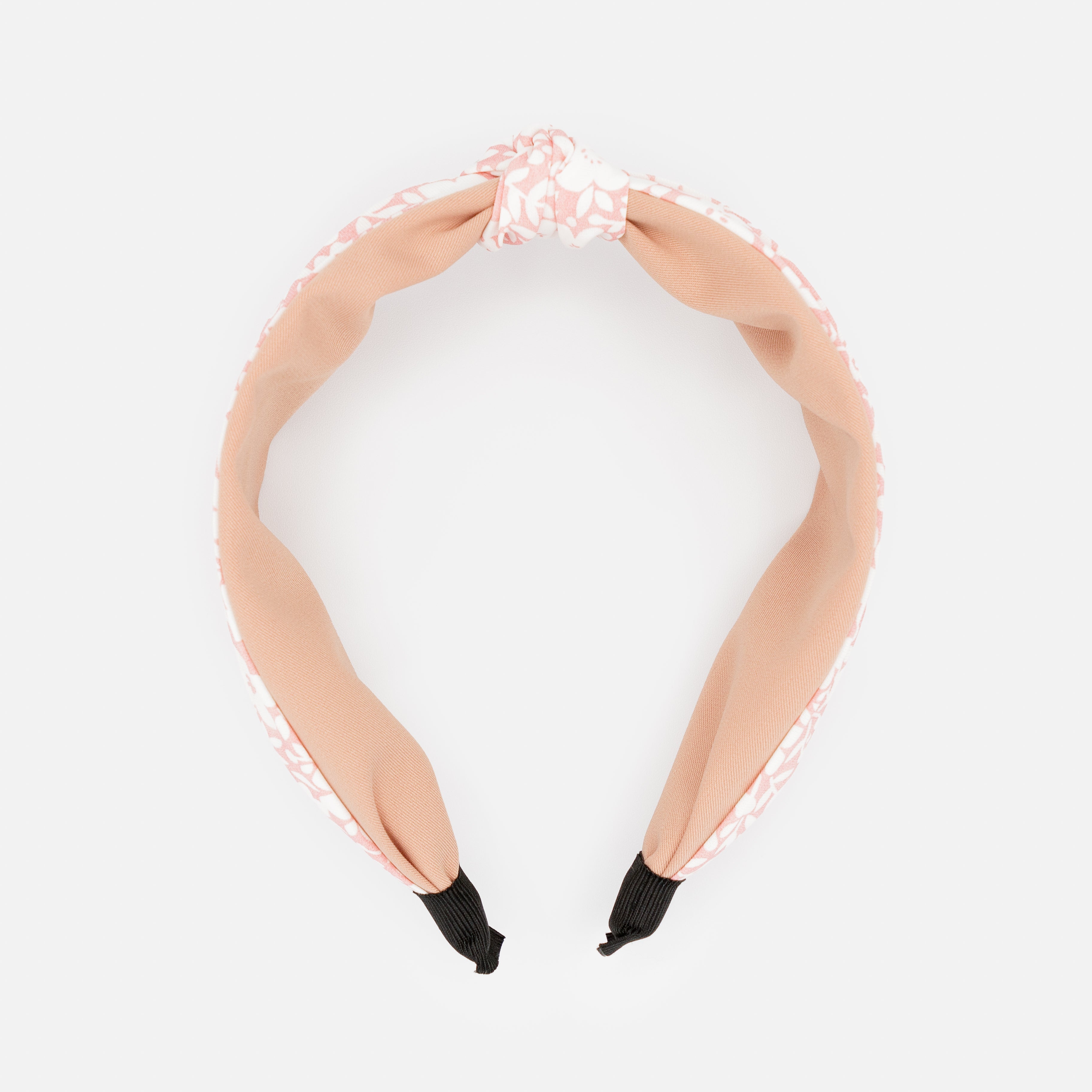 Bandeau rose avec noeud et fleurs blanches