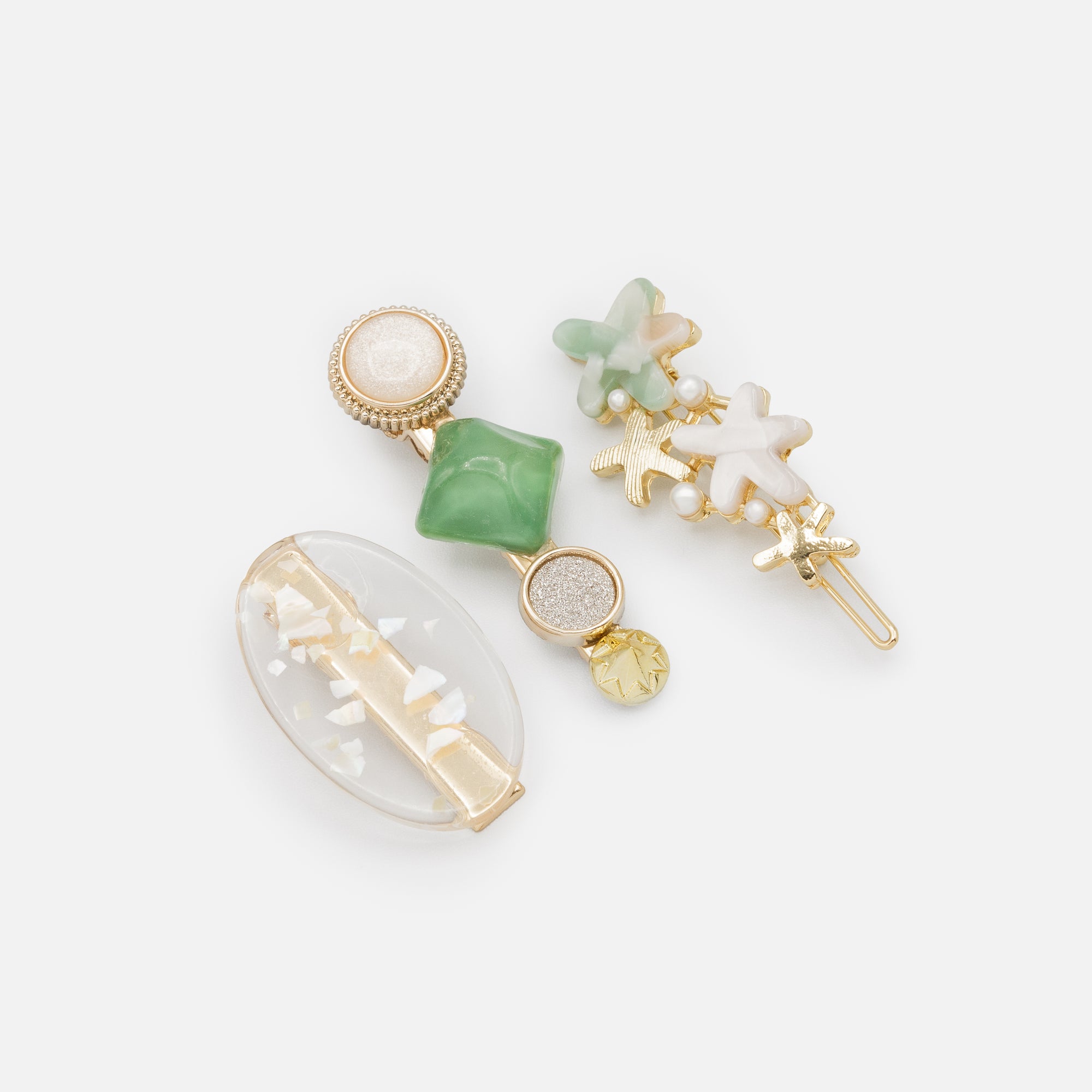 Set of three gold and green starfish clips