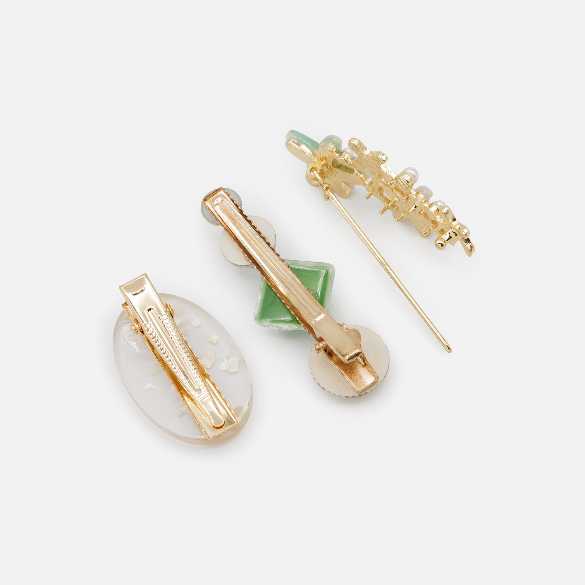 Set of three gold and green starfish clips