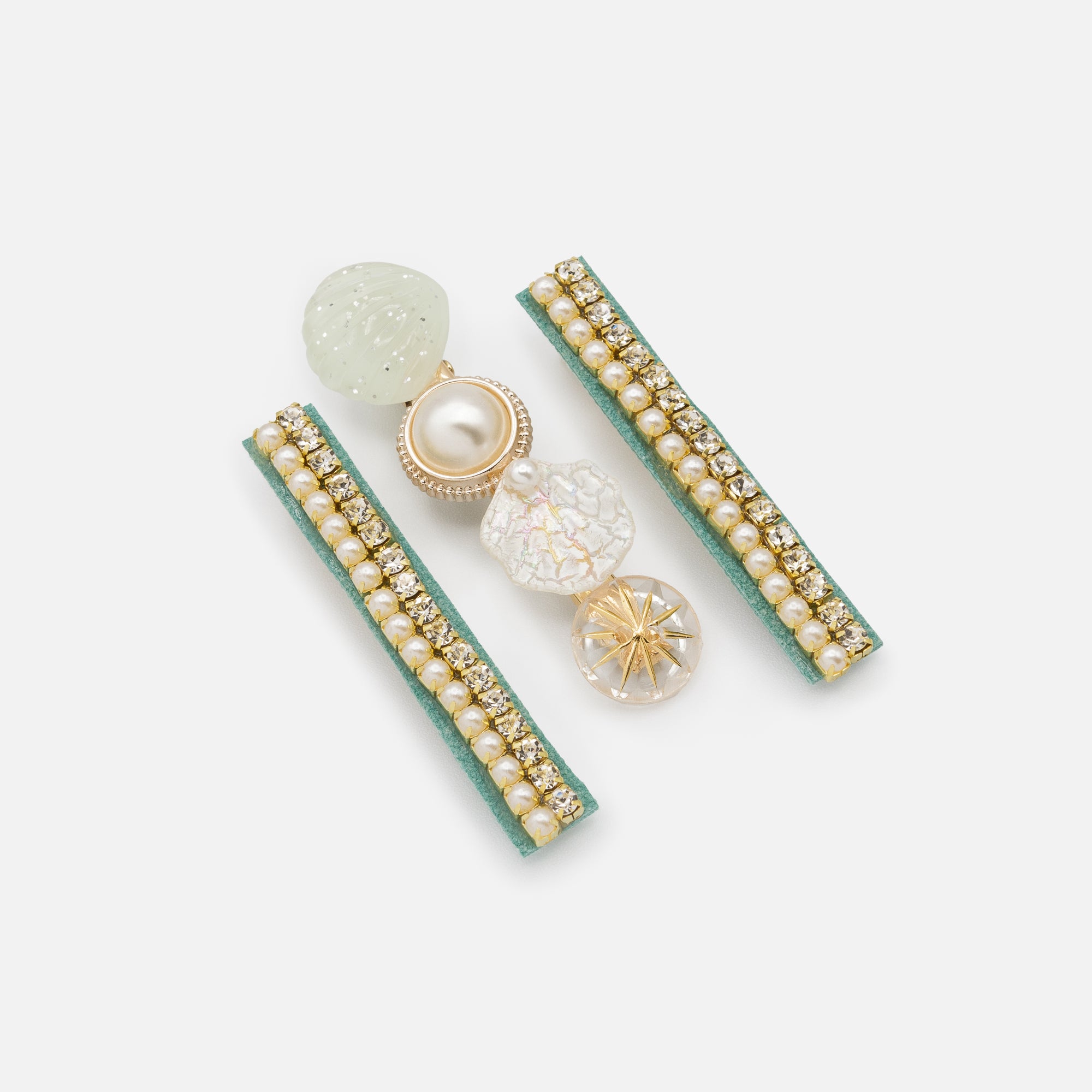 Set of three gold and green shell clips