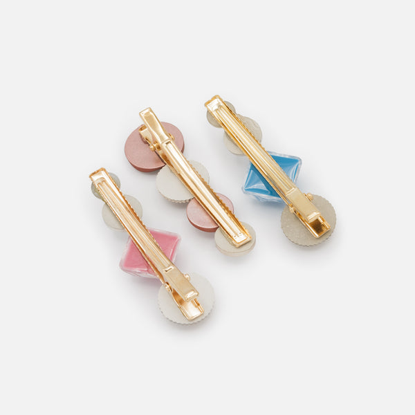 Load image into Gallery viewer, Set of three golden clips with blue and pink stones
