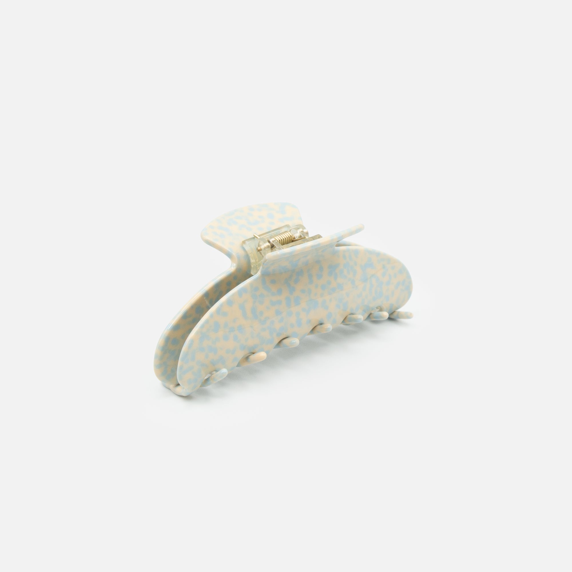 Very large beige and blue speckled clip