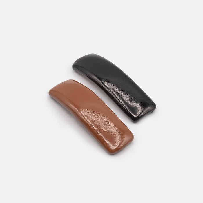 Duo de grandes pinces noire et brune effet cuir lustré