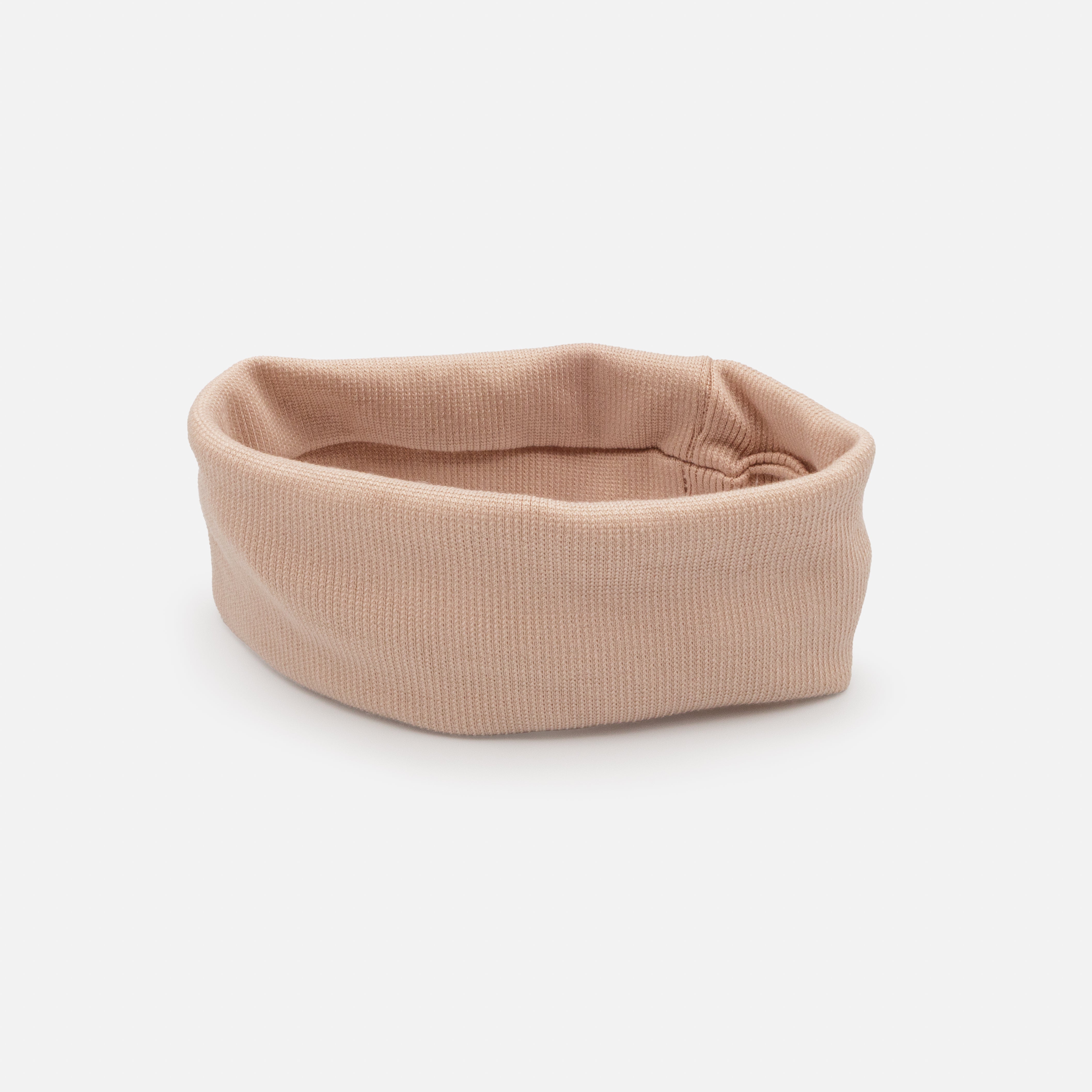 Old pink headband in ribbed fabric