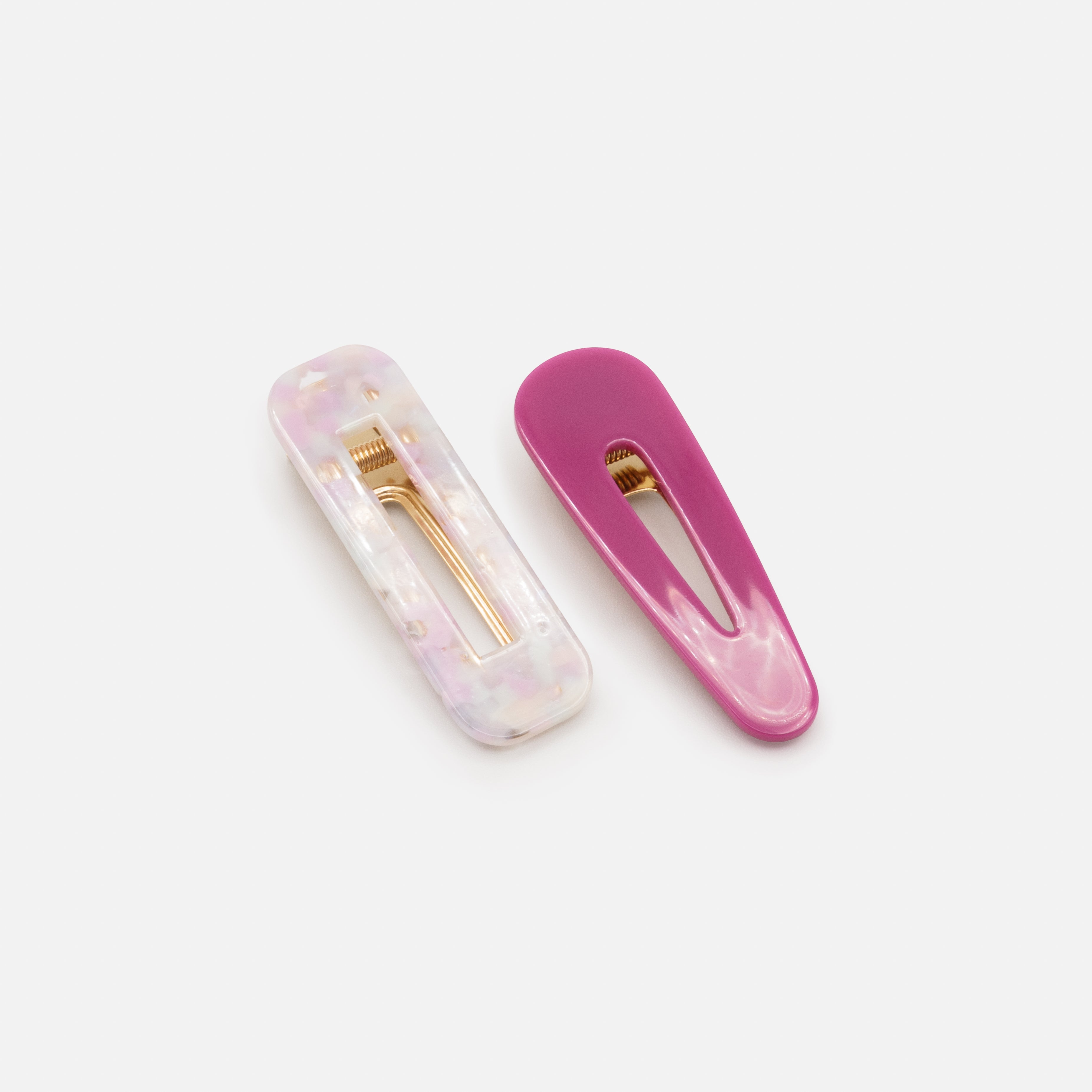 Two plastic clips in shades of mauve