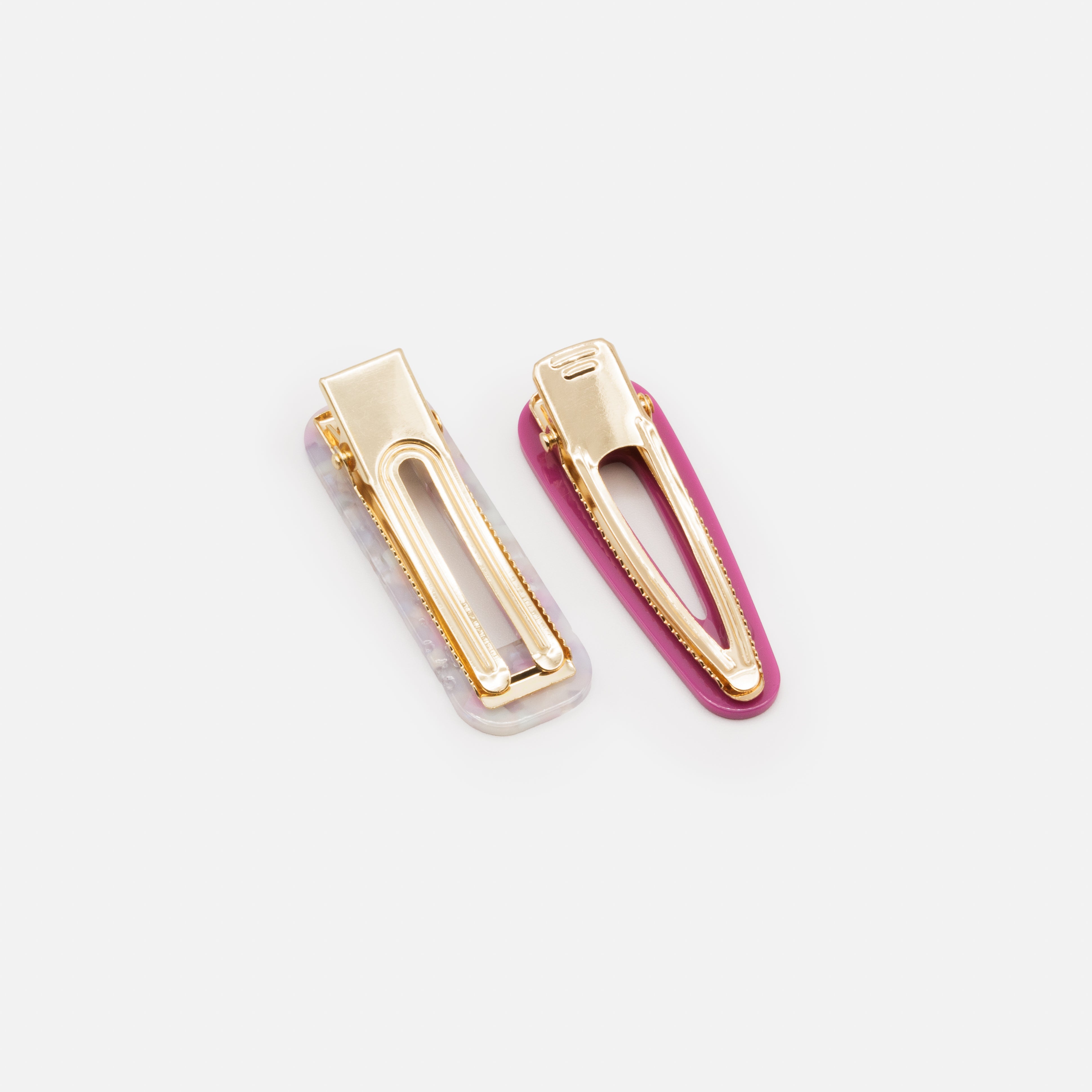 Two plastic clips in shades of mauve
