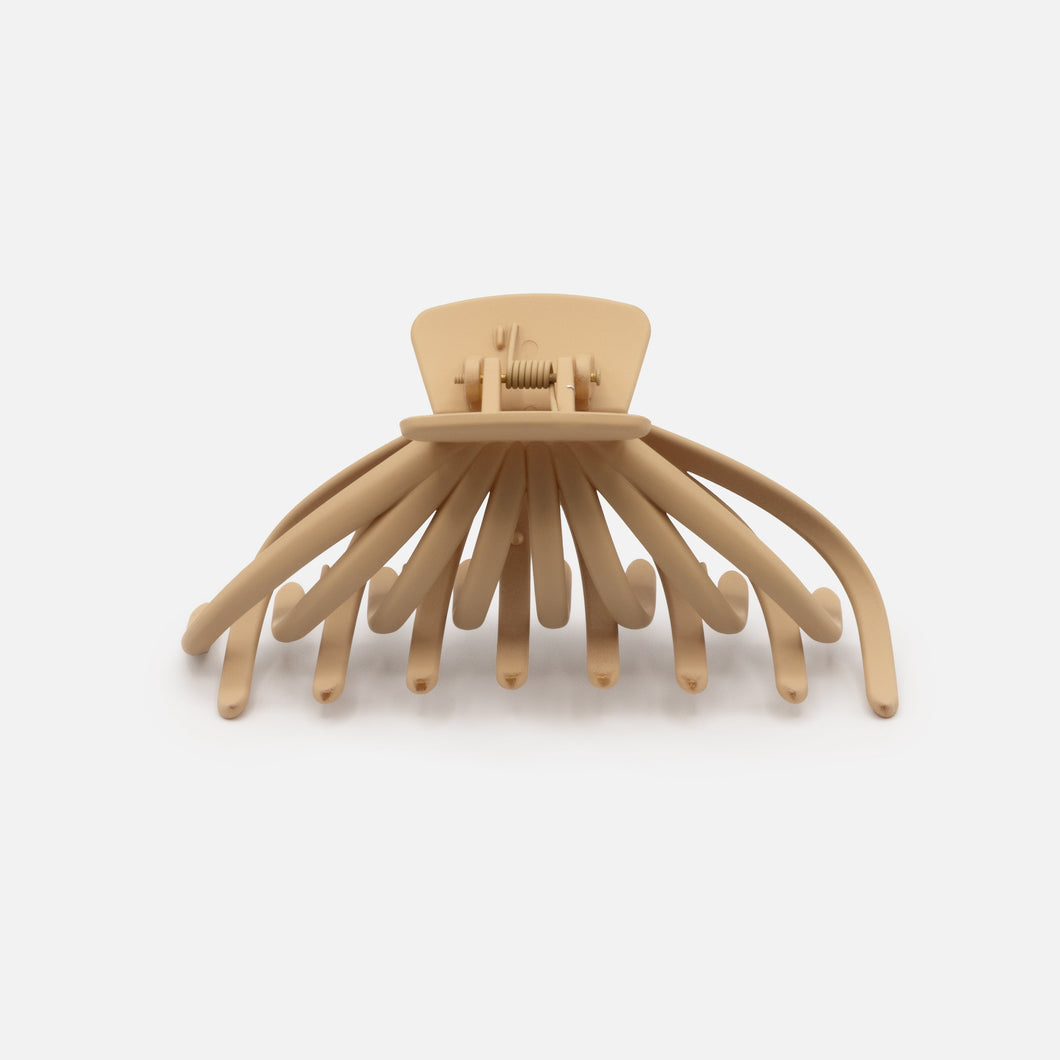 Pince pieuvre beige en plastique au fini mat