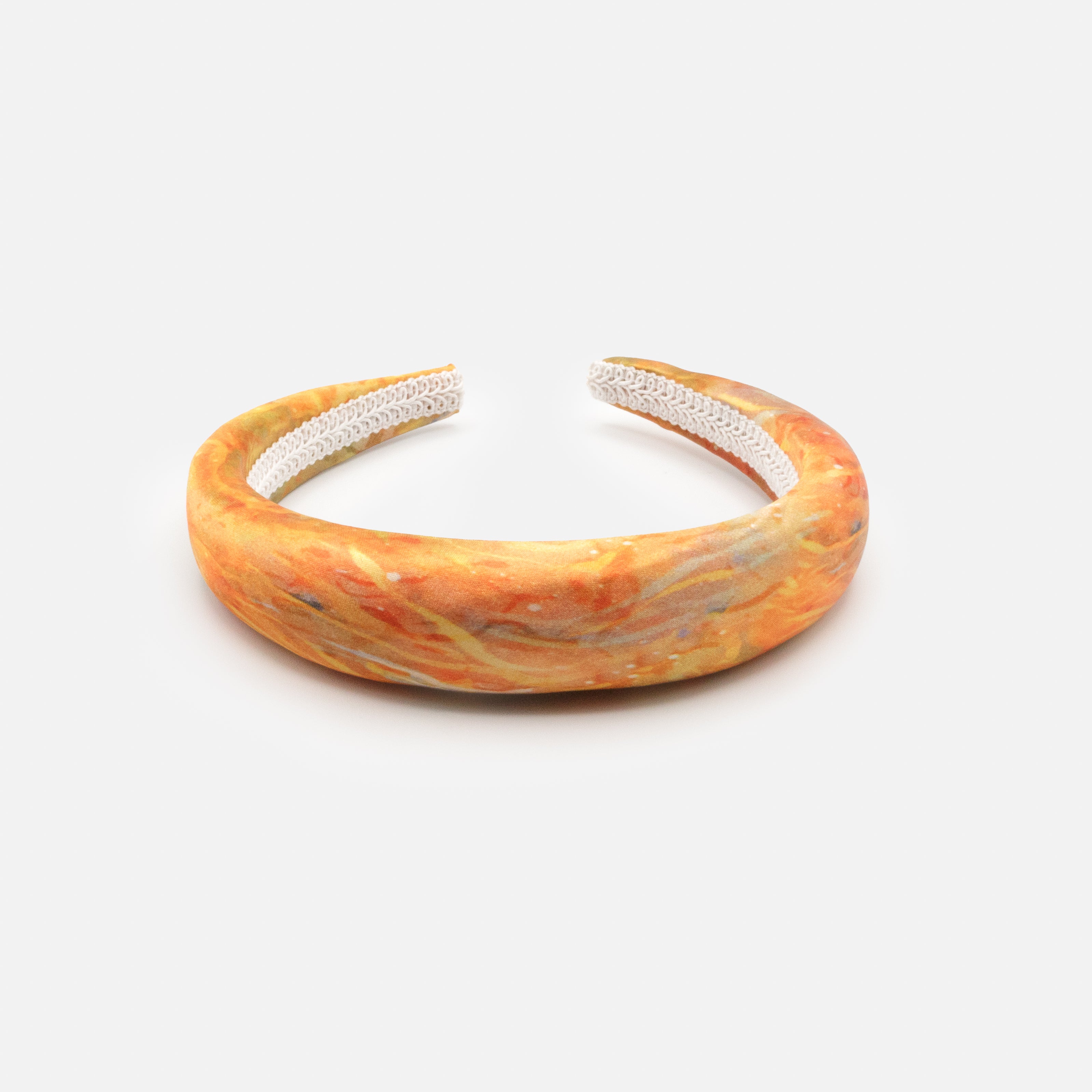 Padded headband in orange tones