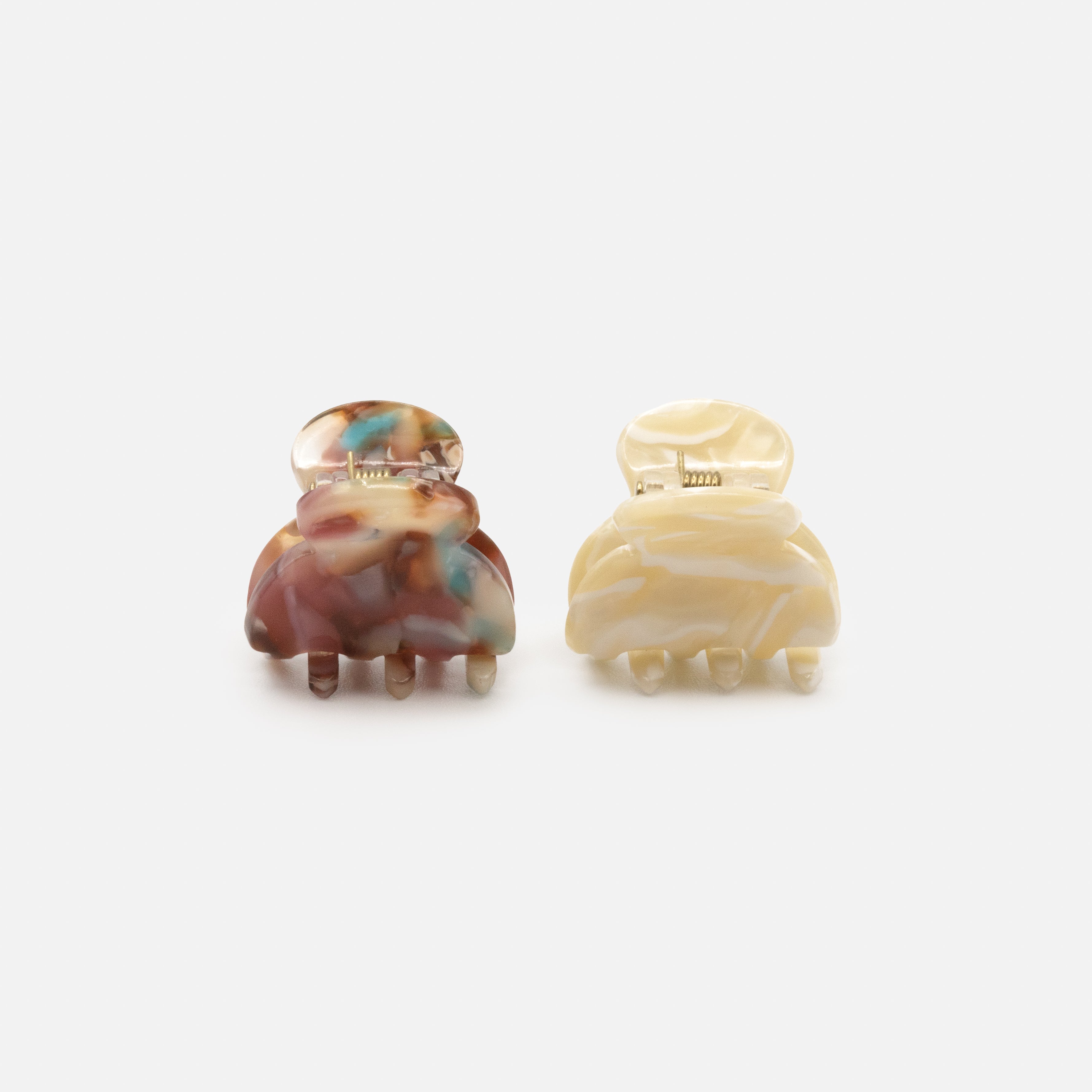 Duo of small ivory &amp; burgundy marbled plastic clips