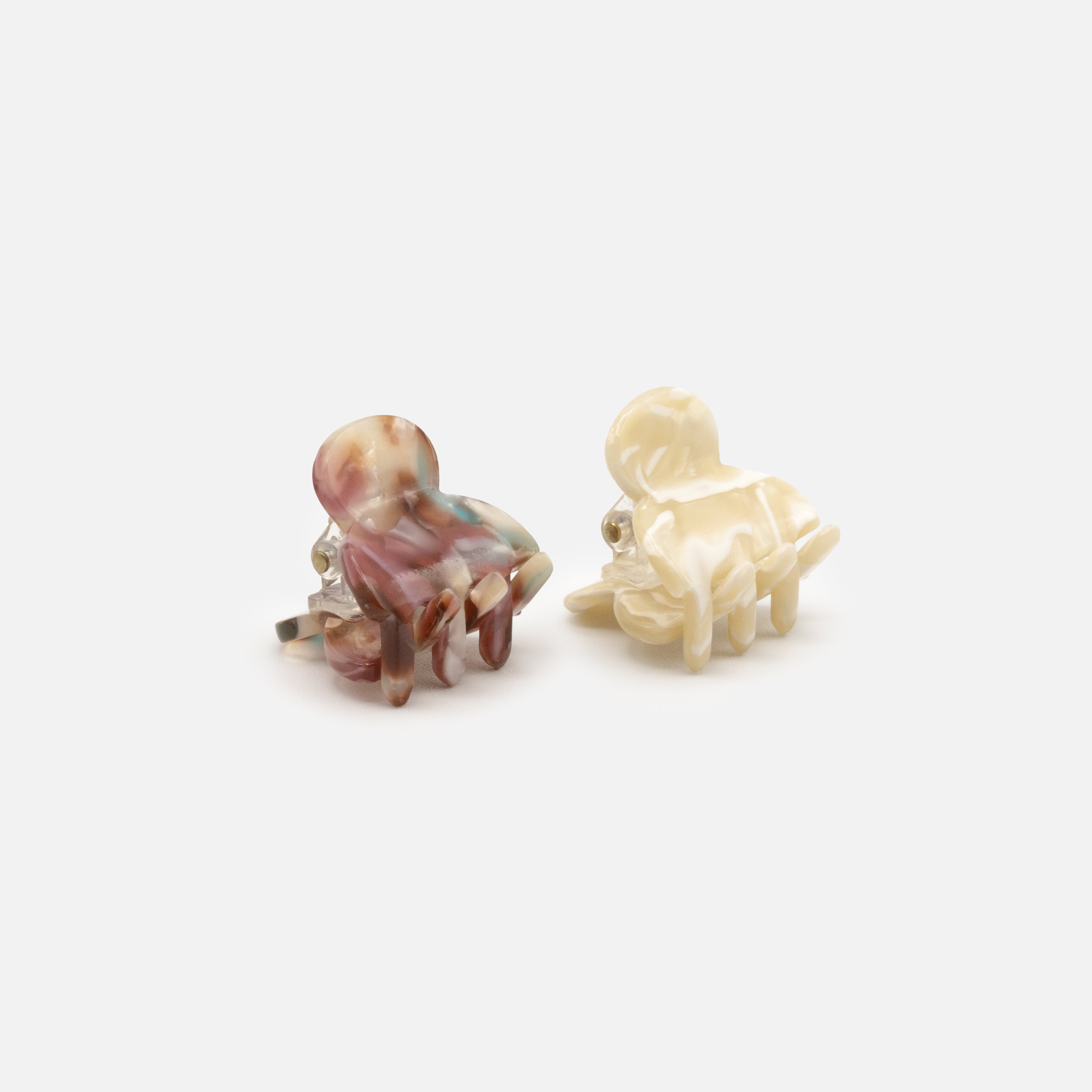 Duo of small ivory &amp; burgundy marbled plastic clips