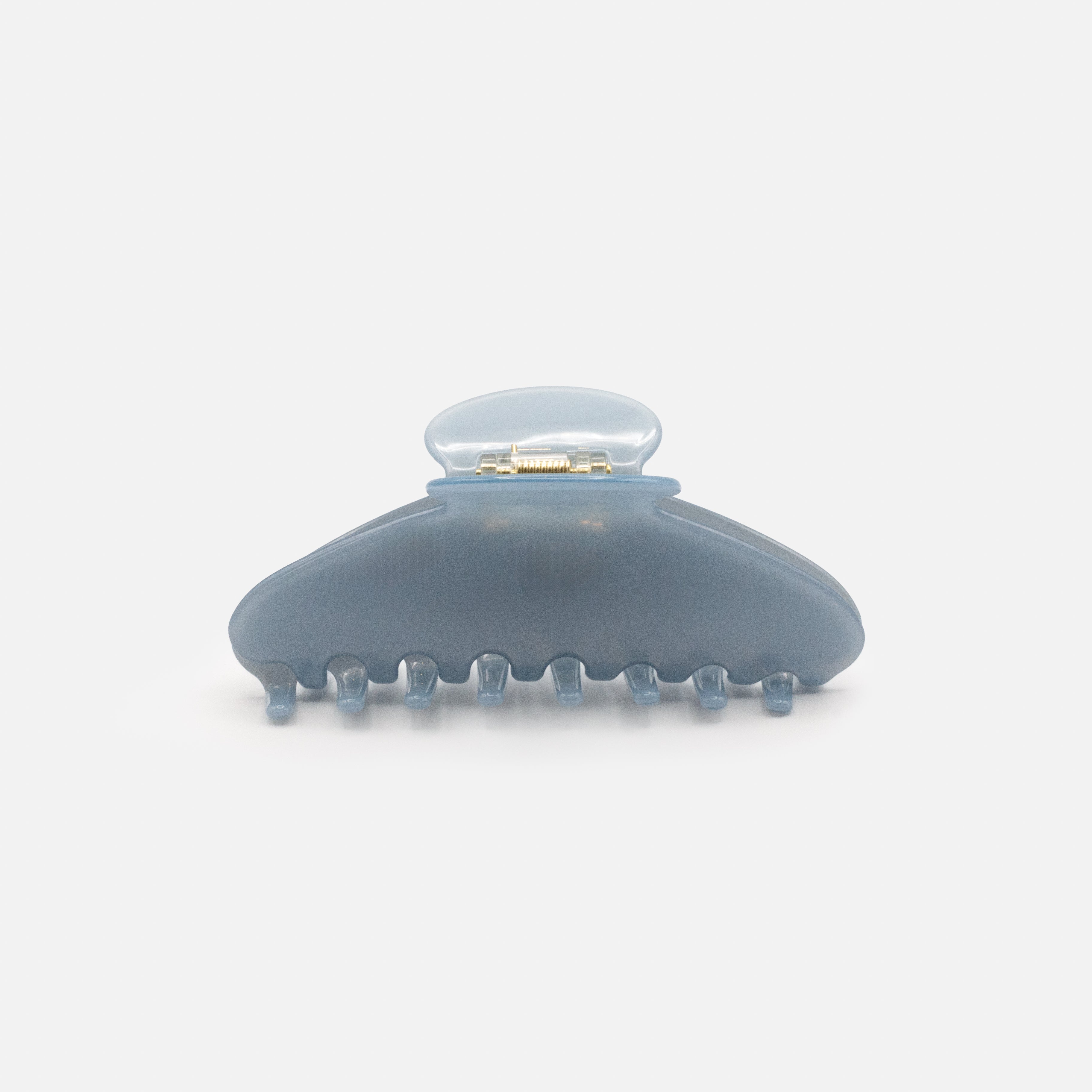 Pale blue plastic clip with a glossy finish