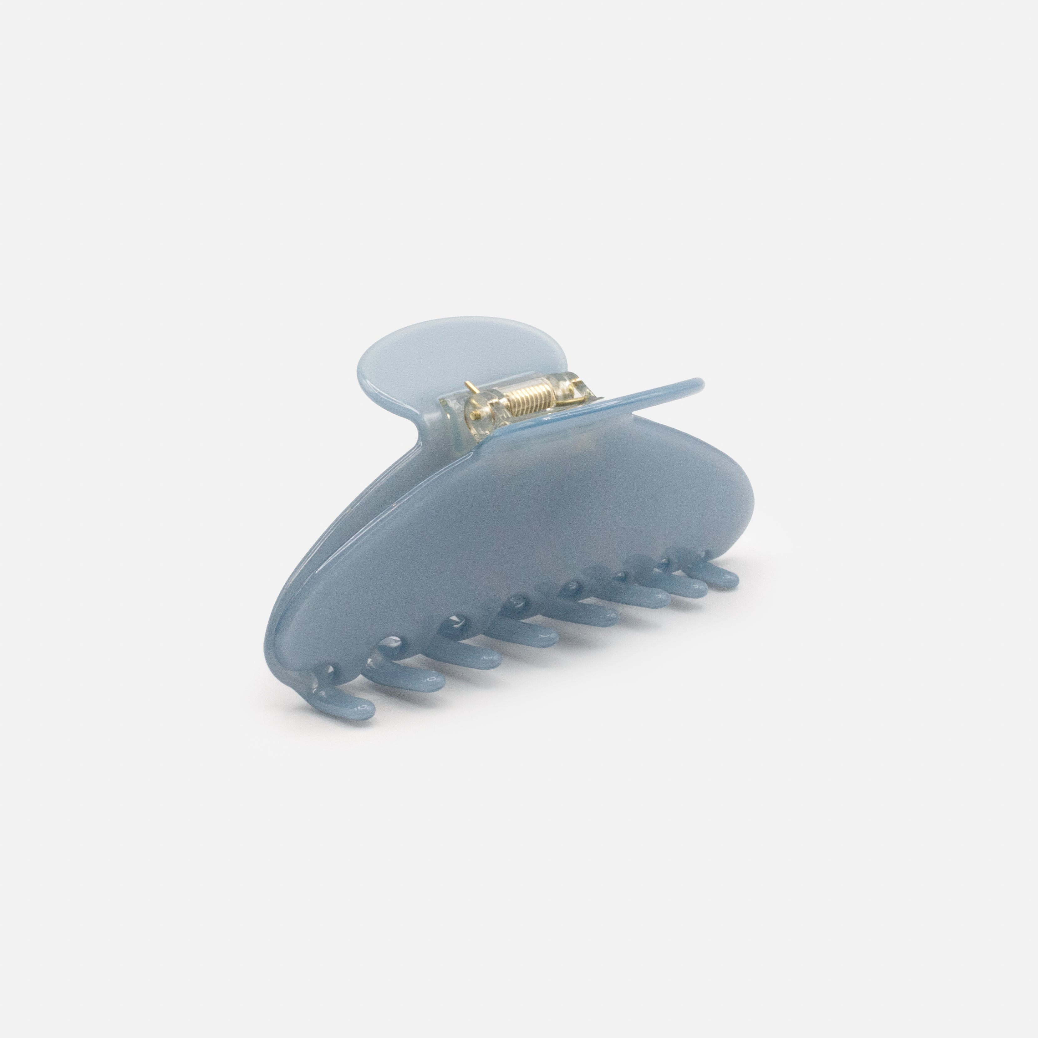 Pale blue plastic clip with a glossy finish