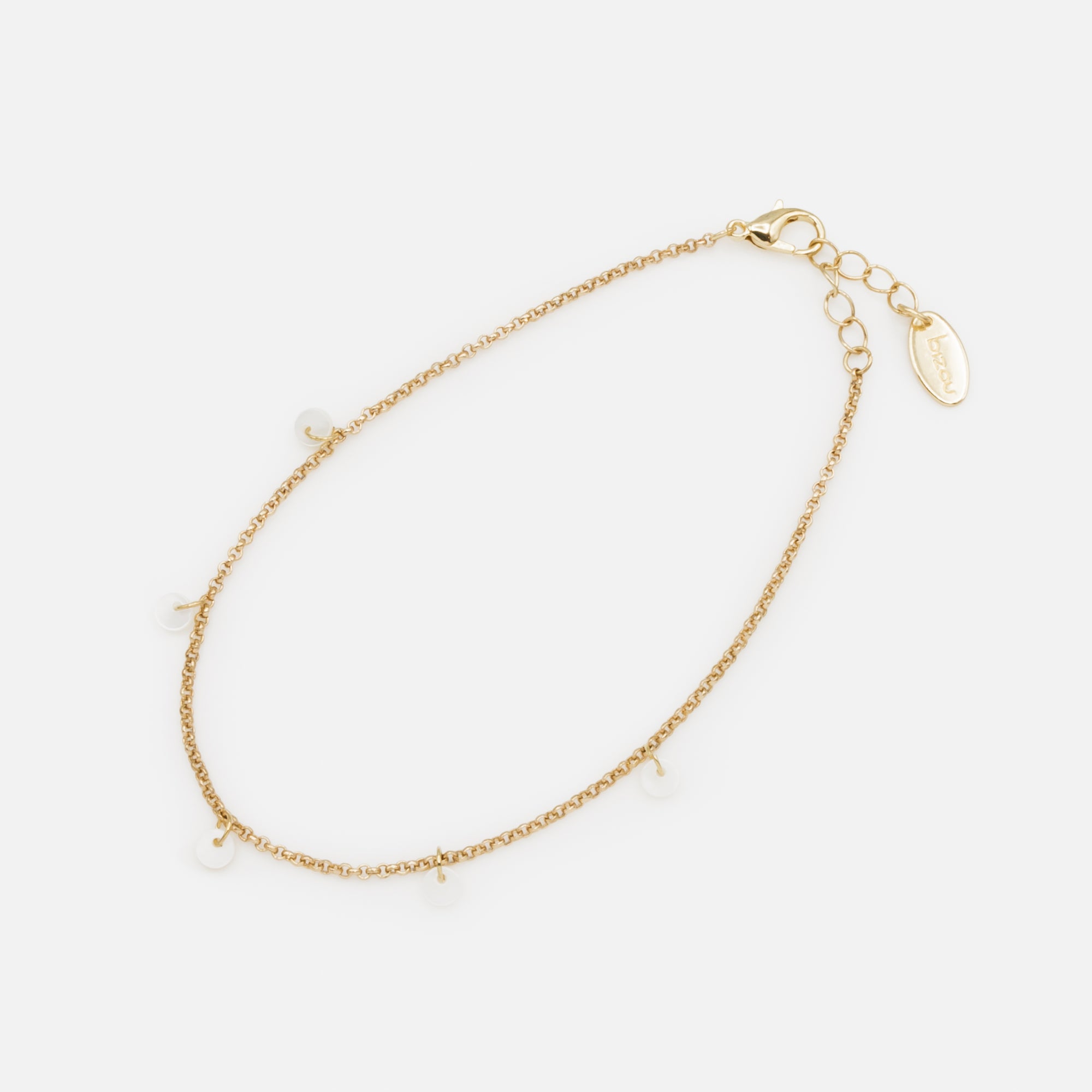 Gold anklet with small pearly discs