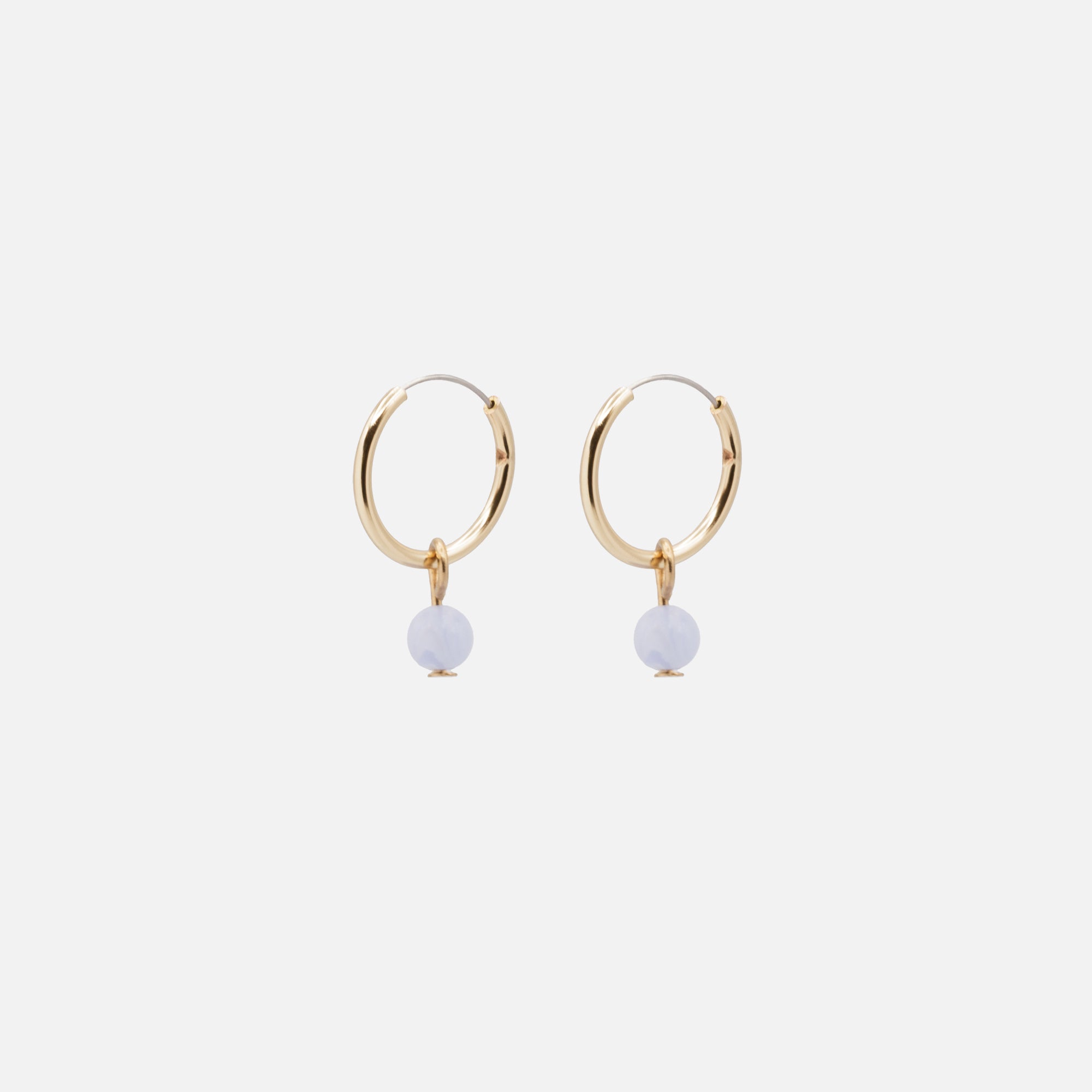 Golden hoop earrings with pale blue round stone charm