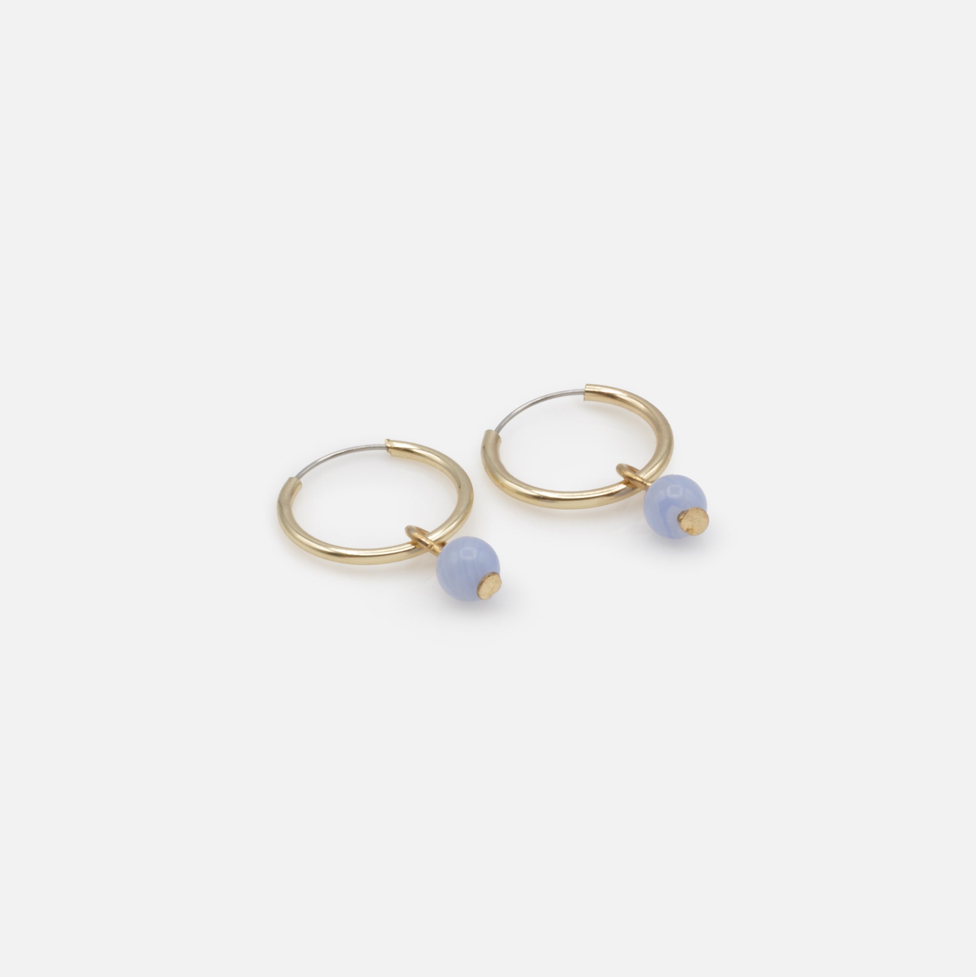 Golden hoop earrings with pale blue round stone charm