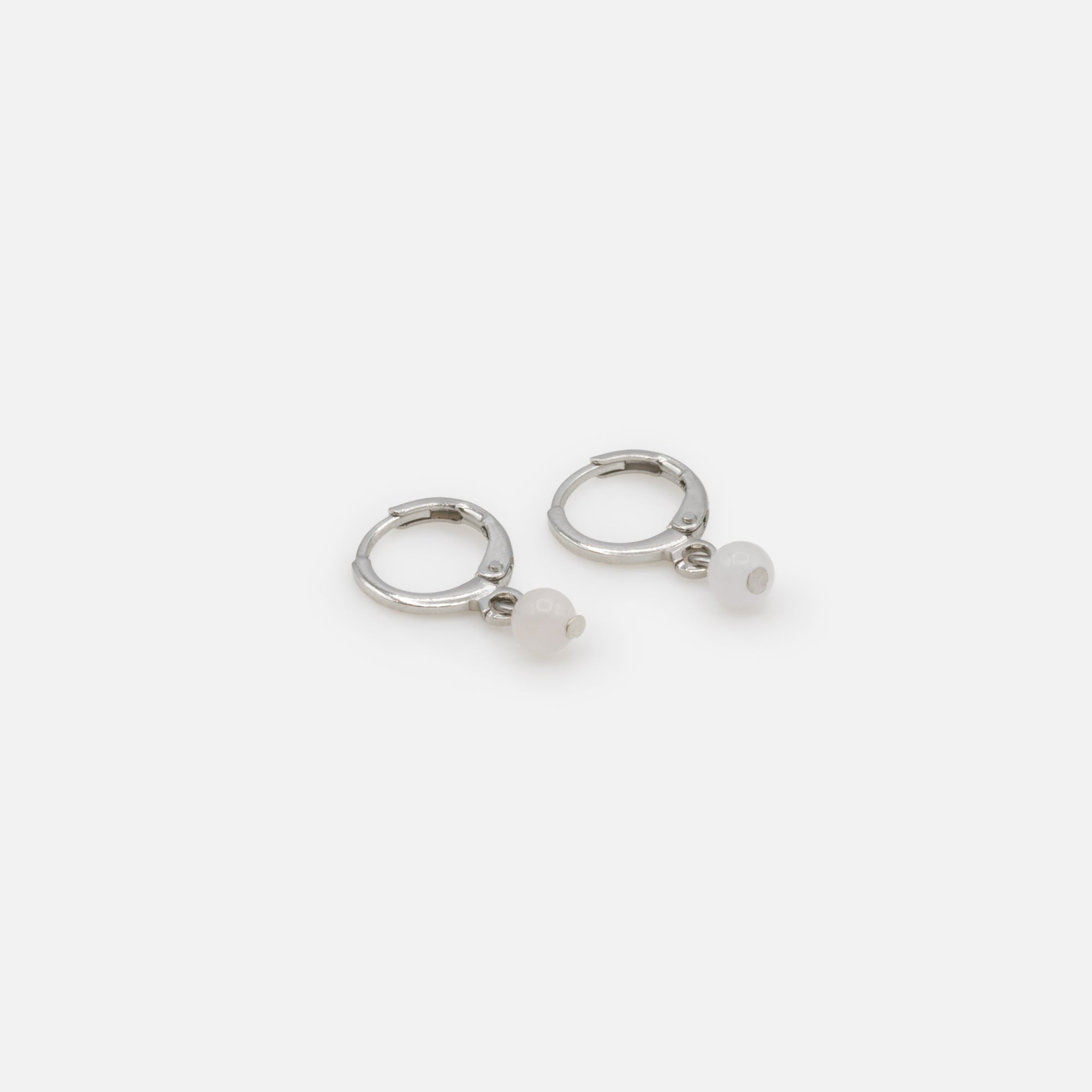 Silver hoop earrings with white round stone charm