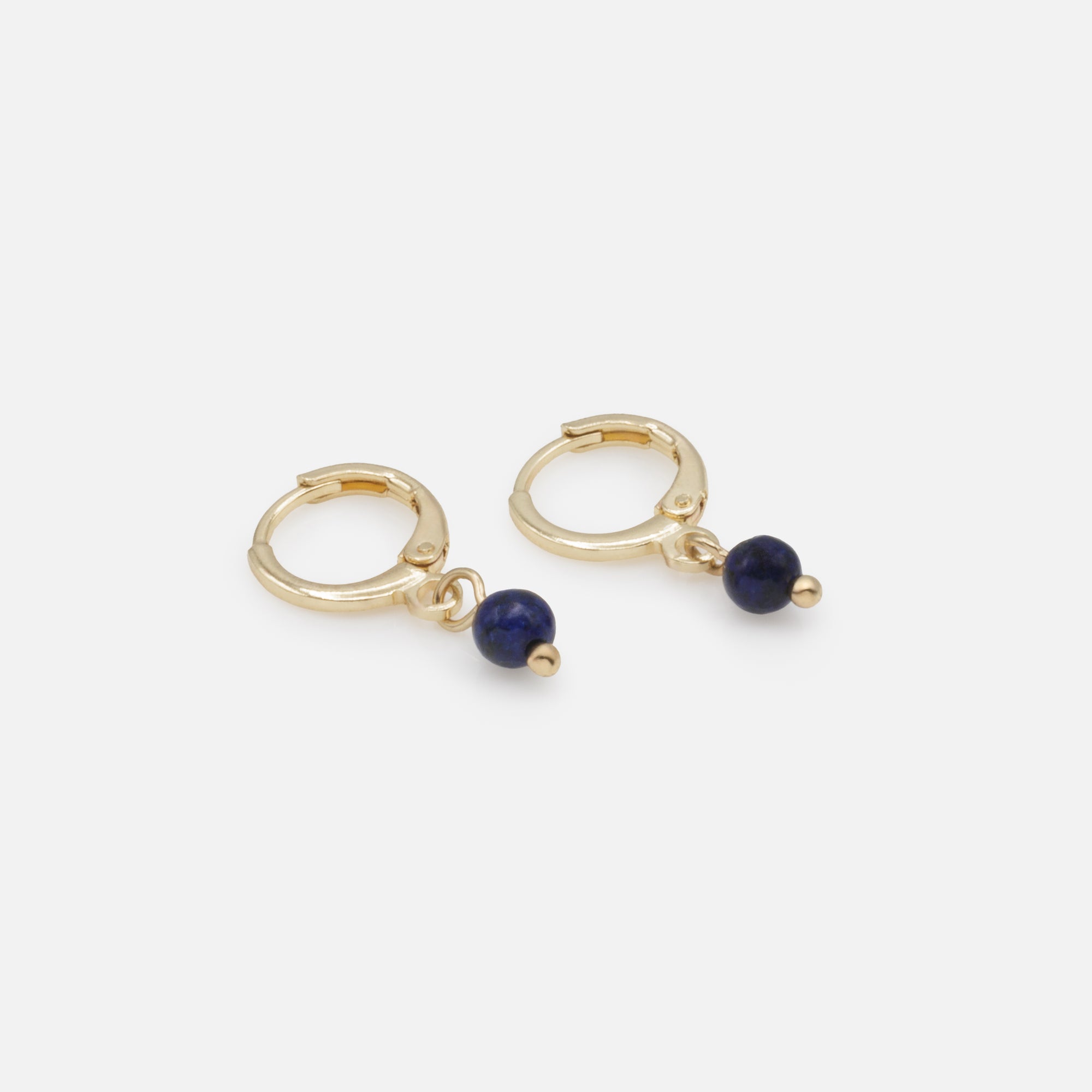 Gold hoop earrings with navy round stone charm