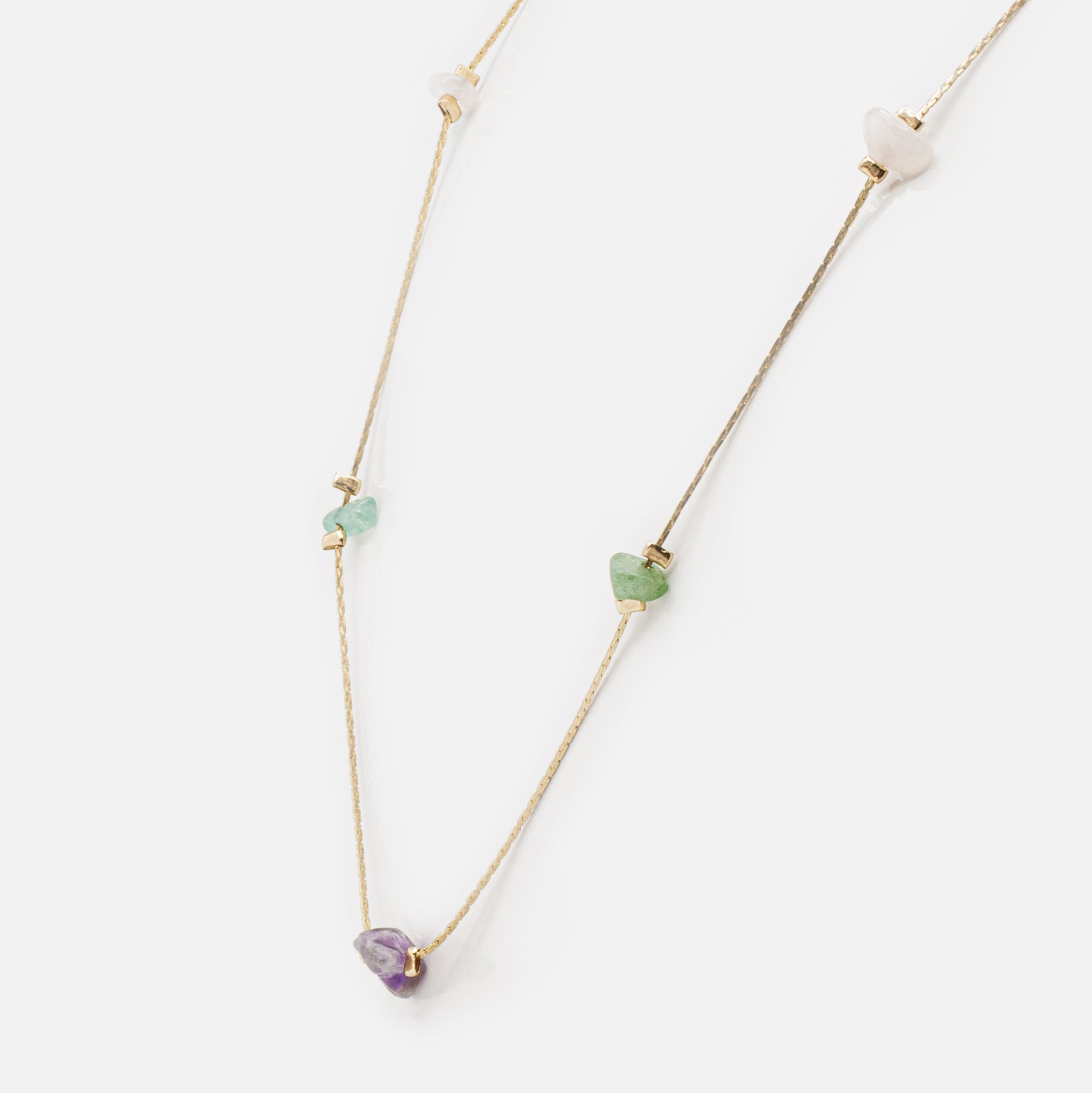 Gold necklace with flat links and colored stones