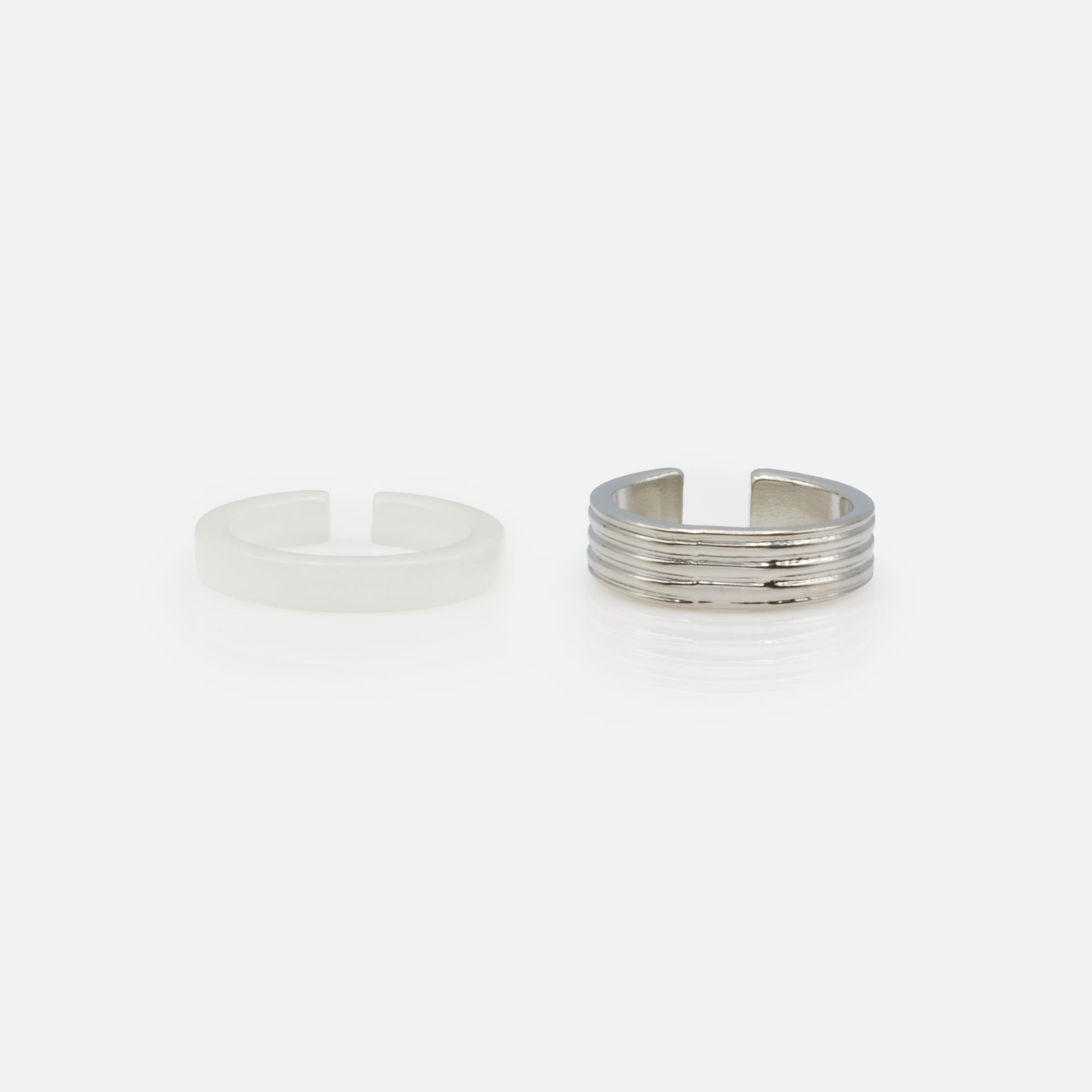 Set of two translucent white and textured silver open rings