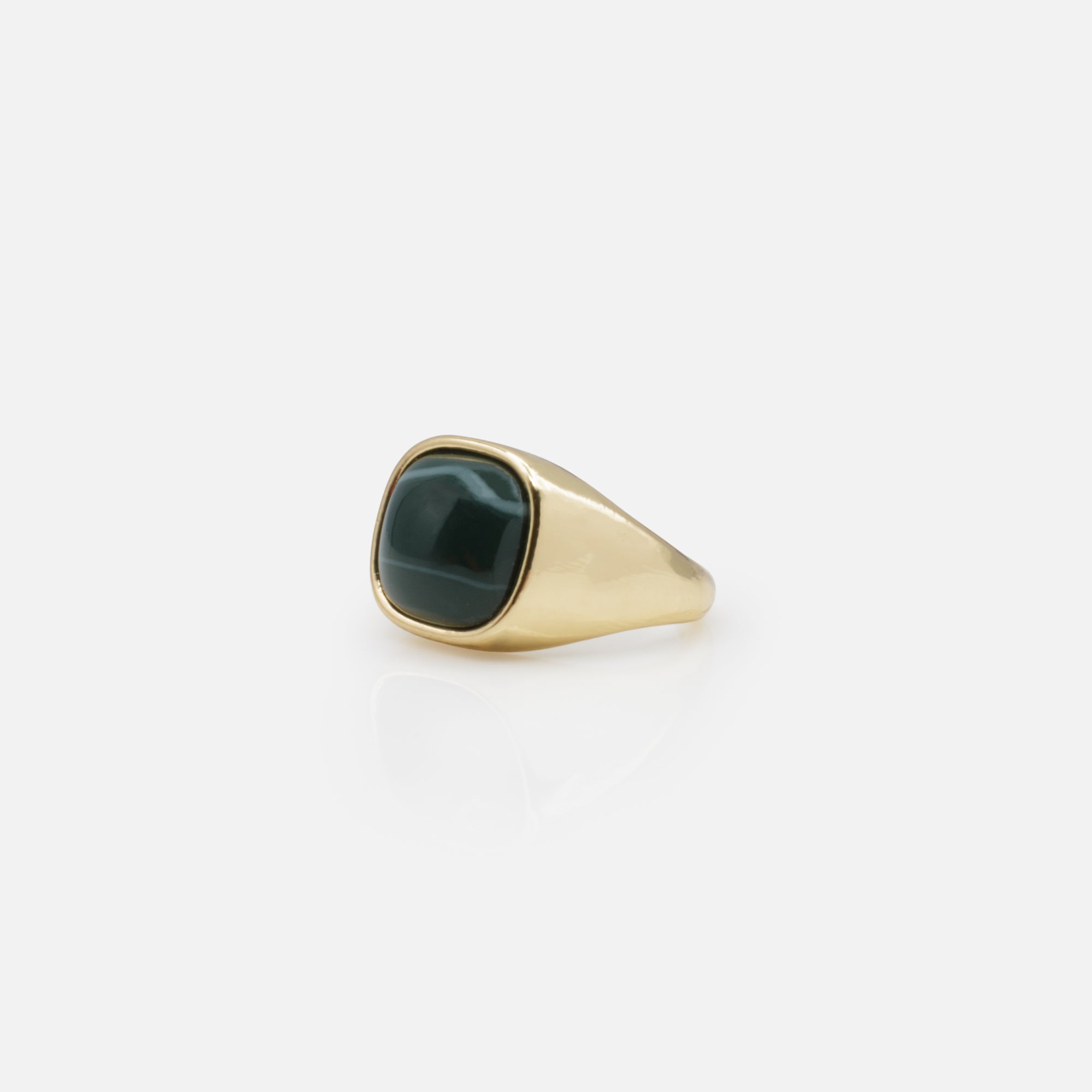 Golden open ring with green stone