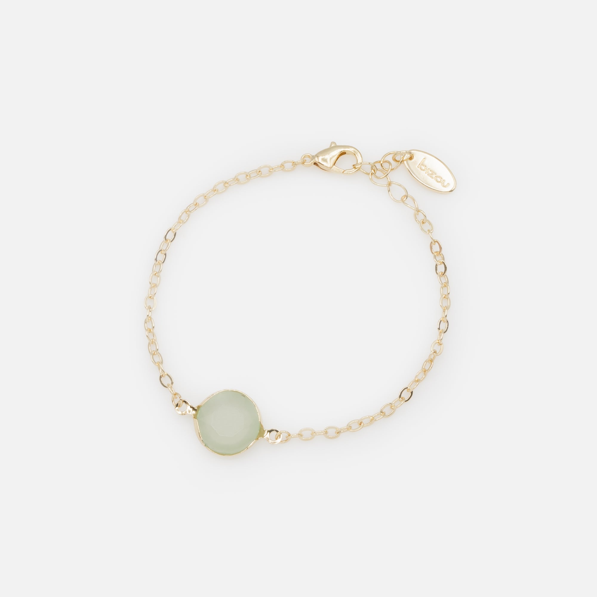 Gold chain link bracelet with pale green circular stone