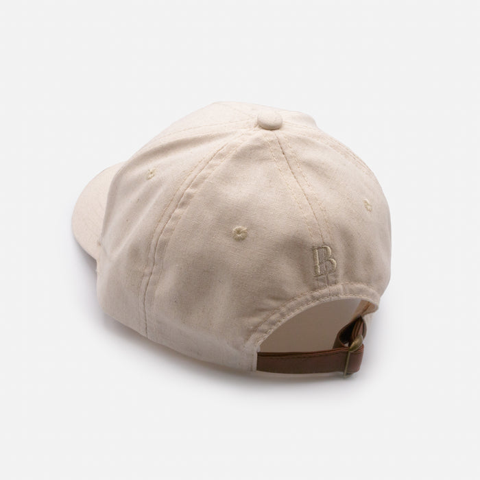 Casquette ivoire en lin avec sangle en similicuir
