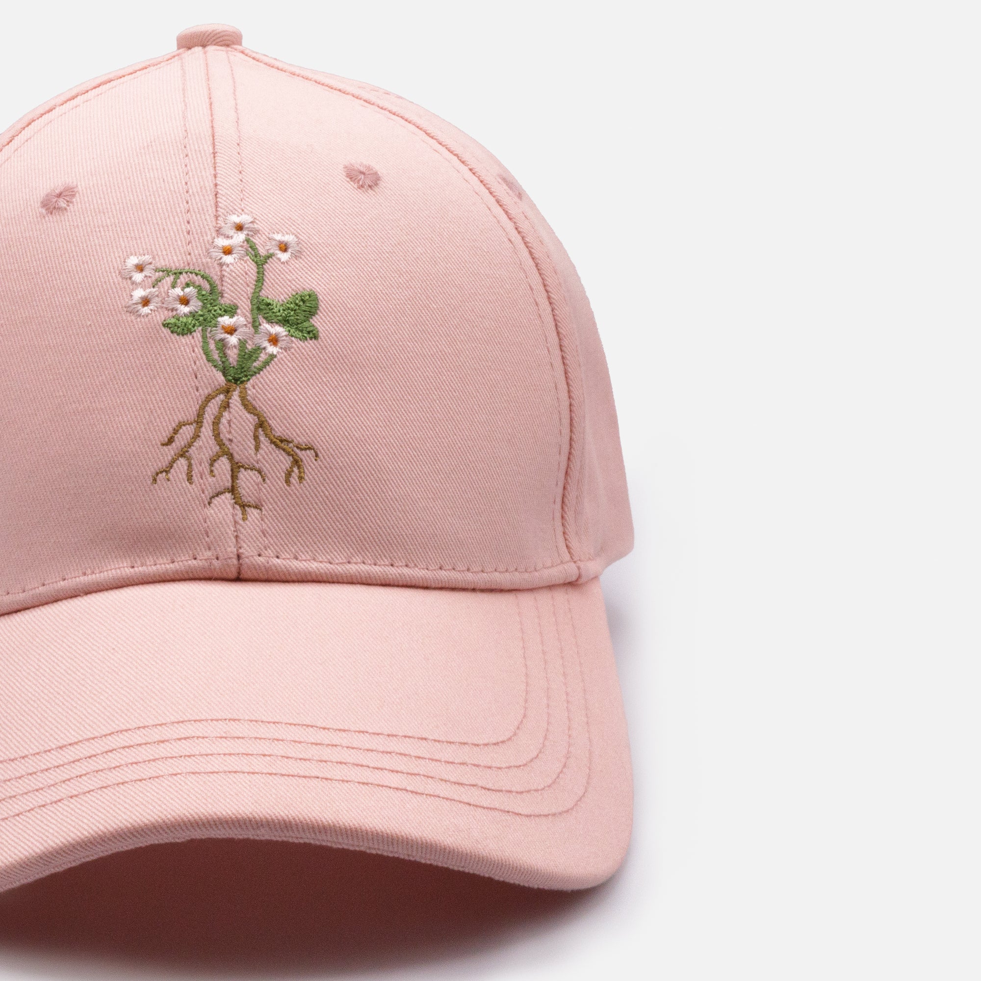 Pale pink cap with embroidered stem flowers