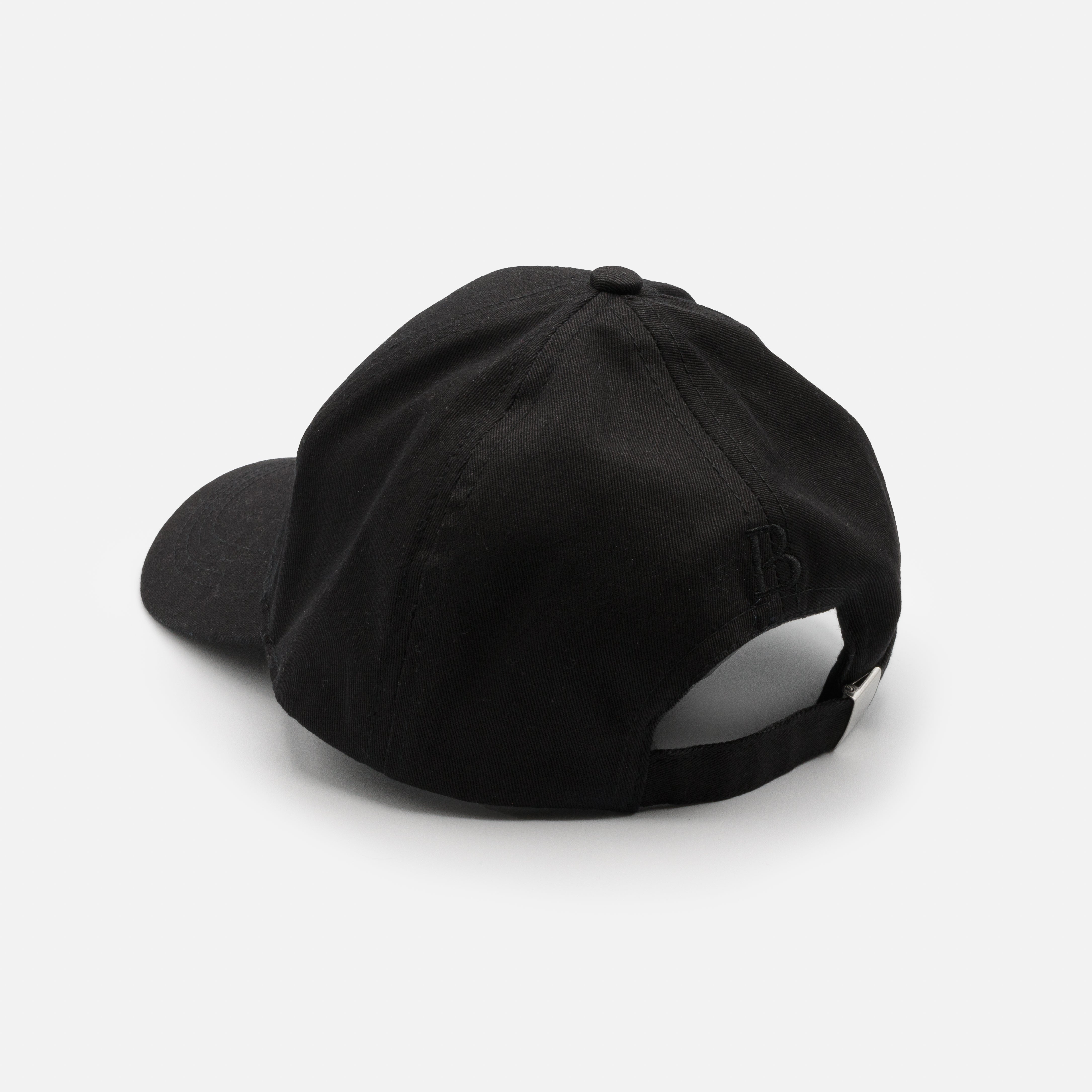 Casquette noire avec broderie fleur blanche