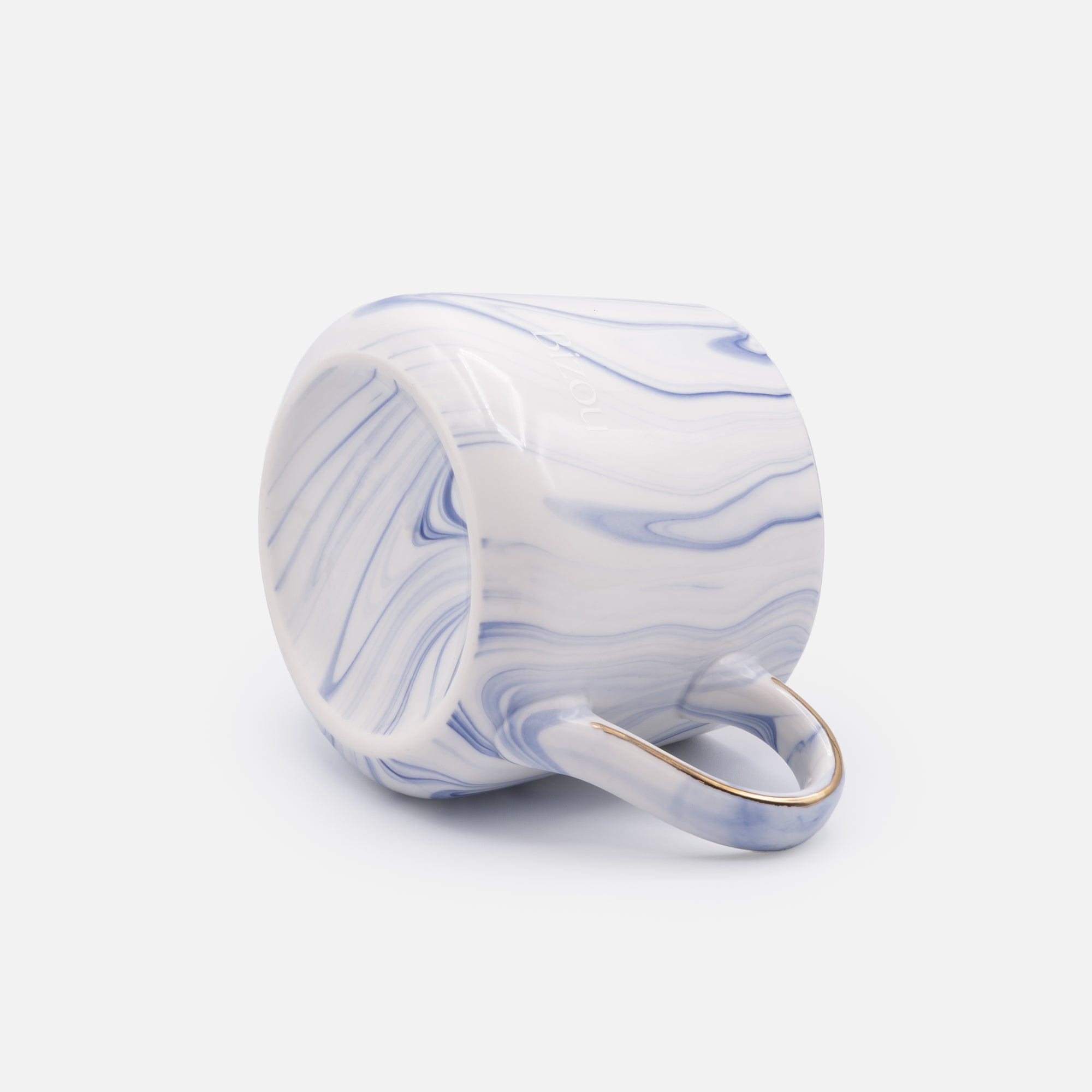 White ceramic mug with blue marbling