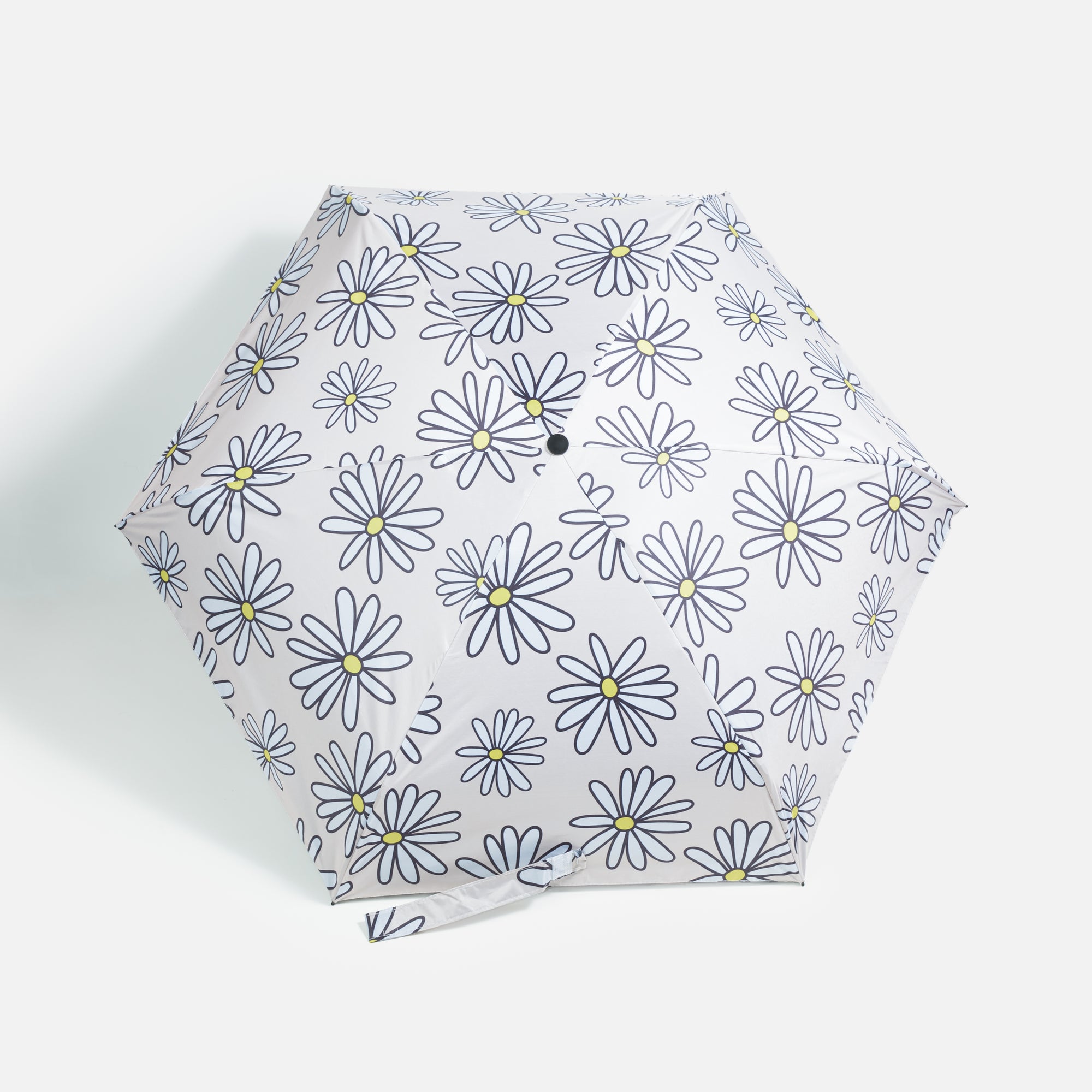 Beige umbrella with daisies and storage bag