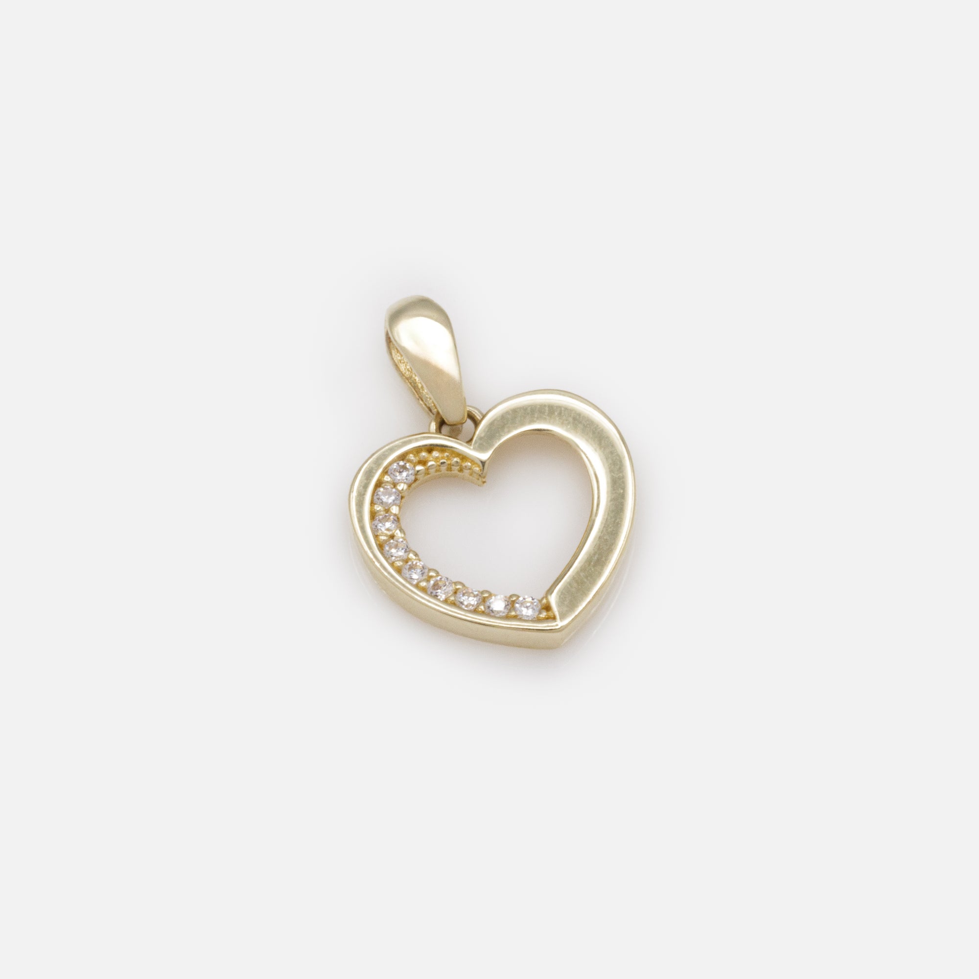 Heart charm with inner row of cubic zirconia in 10 carat gold