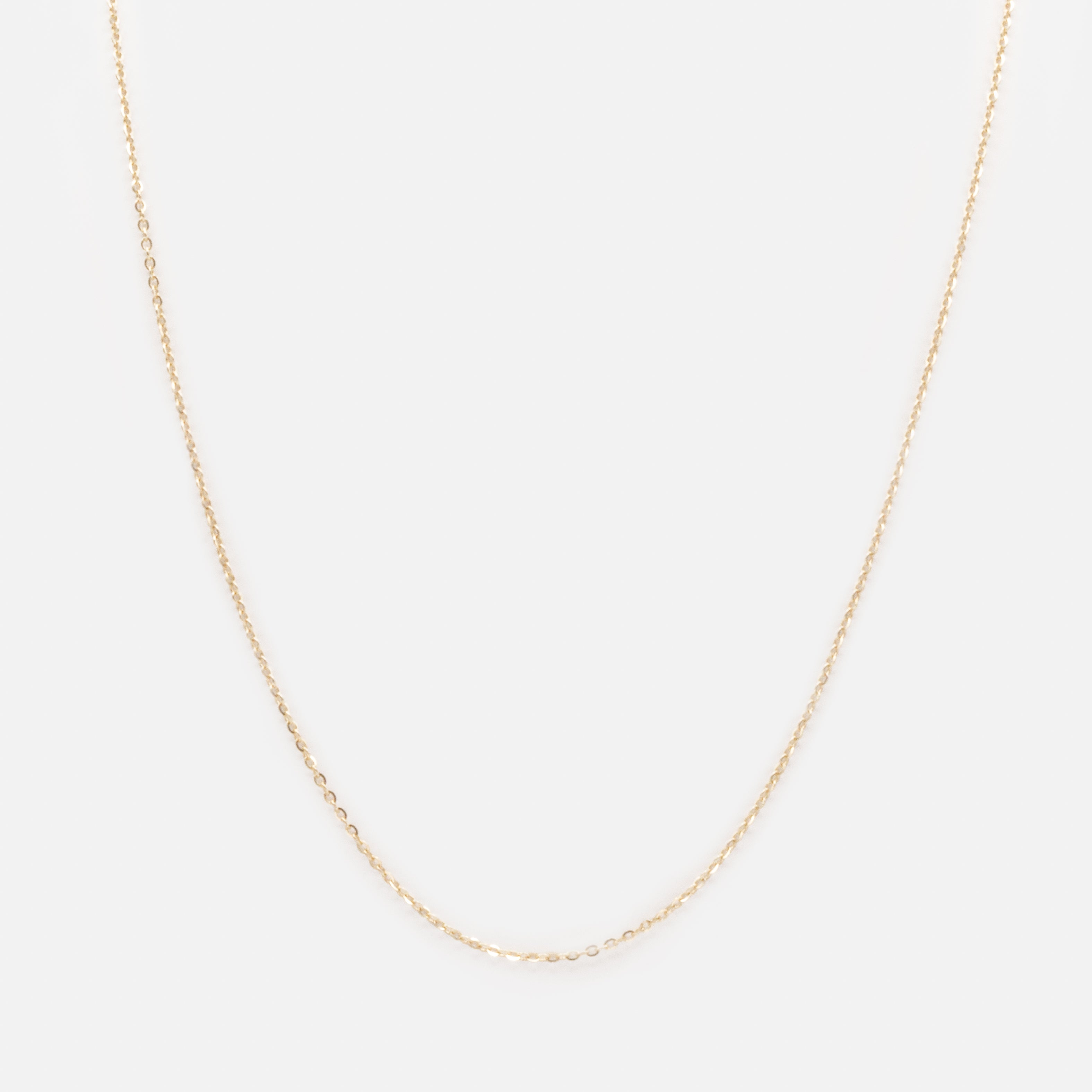 Chaîne 16 pouces à petites mailles forçat rondes en or 10 carats