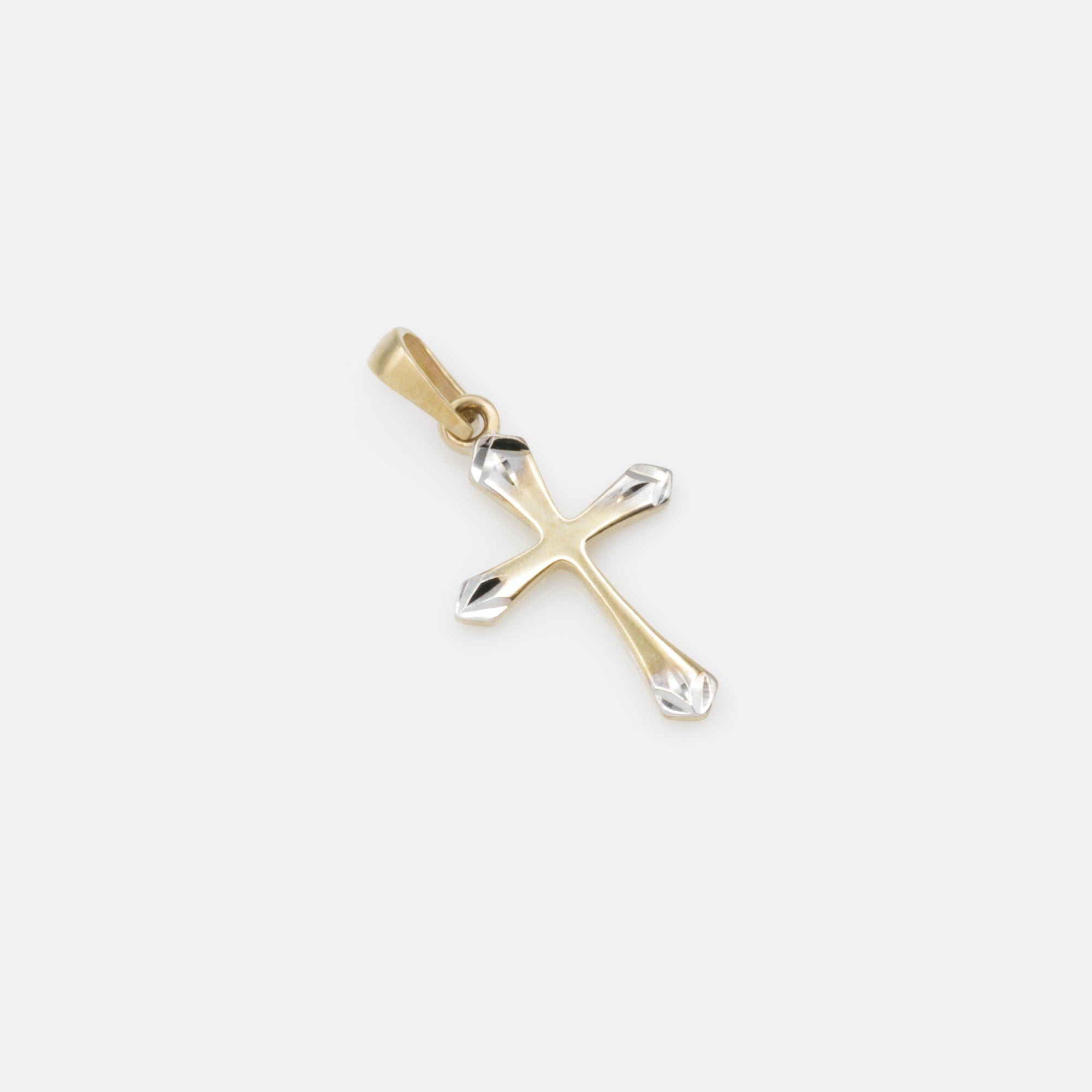 2-tone cross charm with end detail in 10k gold