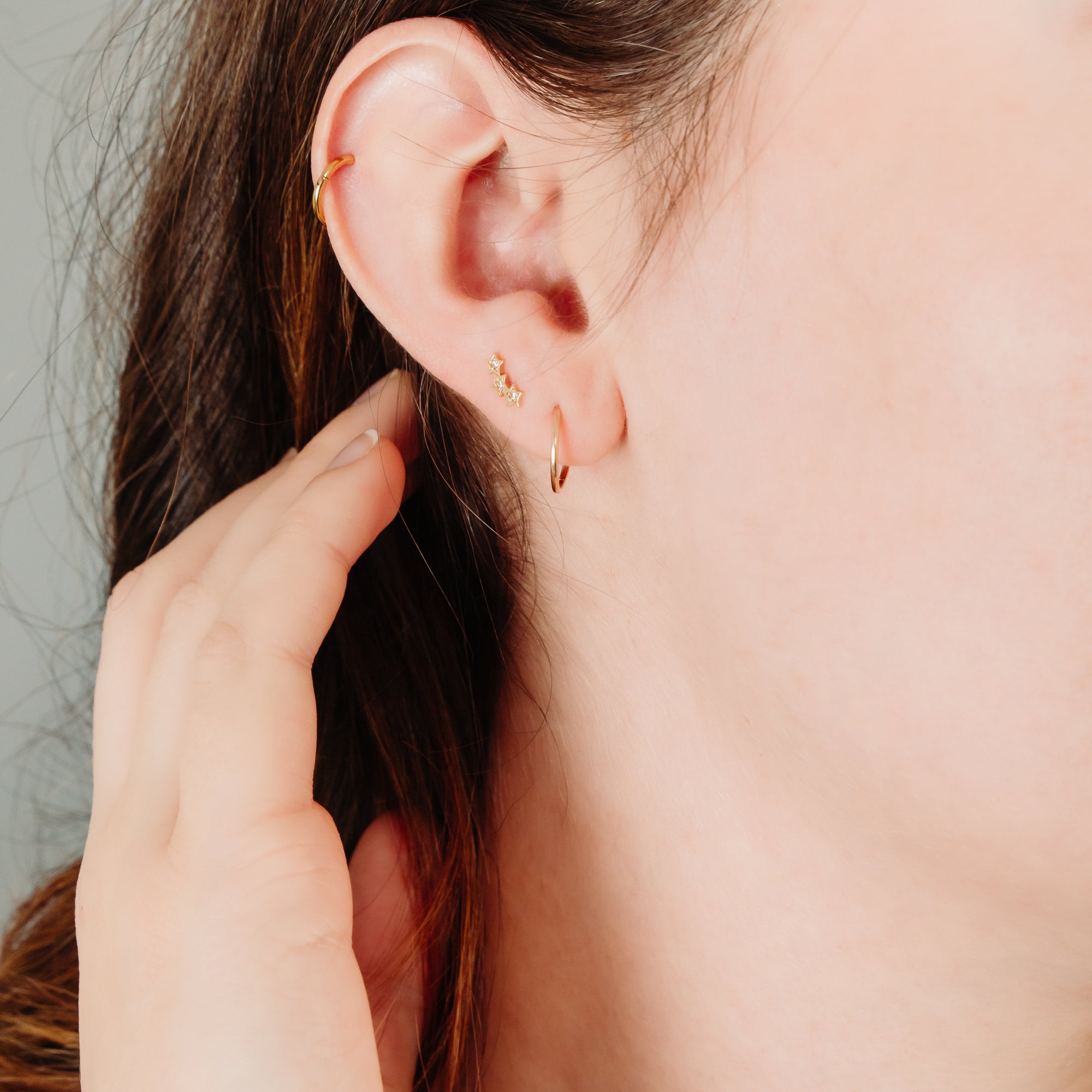 10k gold fixed earrings with three stars
