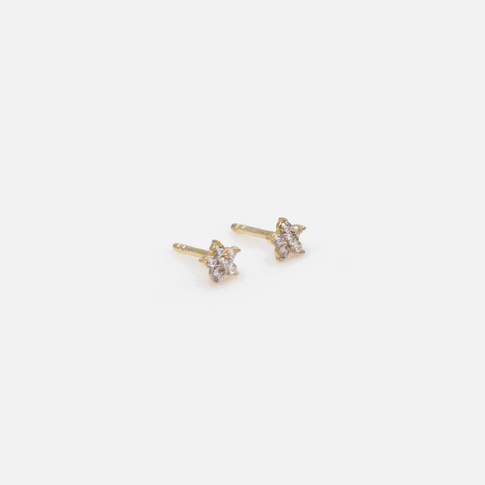 Small cubic zirconia flower earrings in 10k gold
