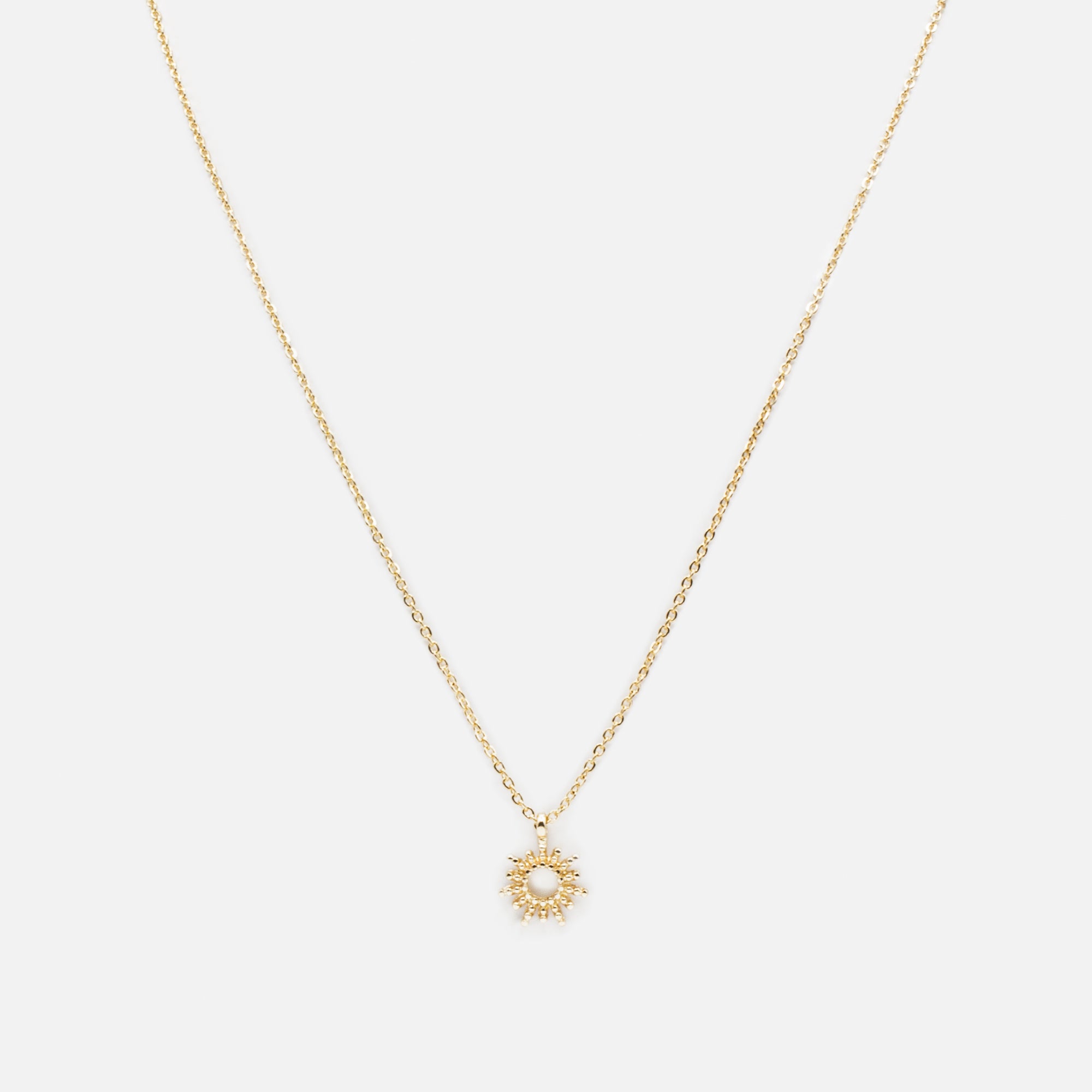 Collier doré pendentif soleil