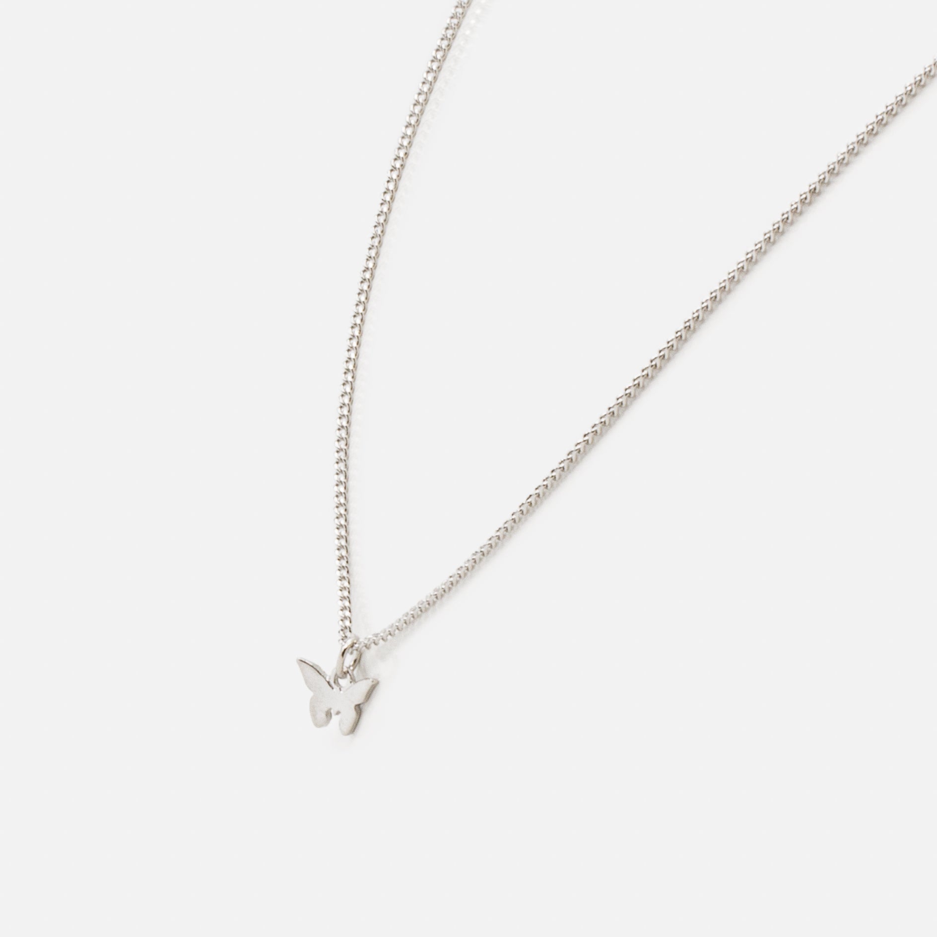 Silver necklace with small butterfly charm