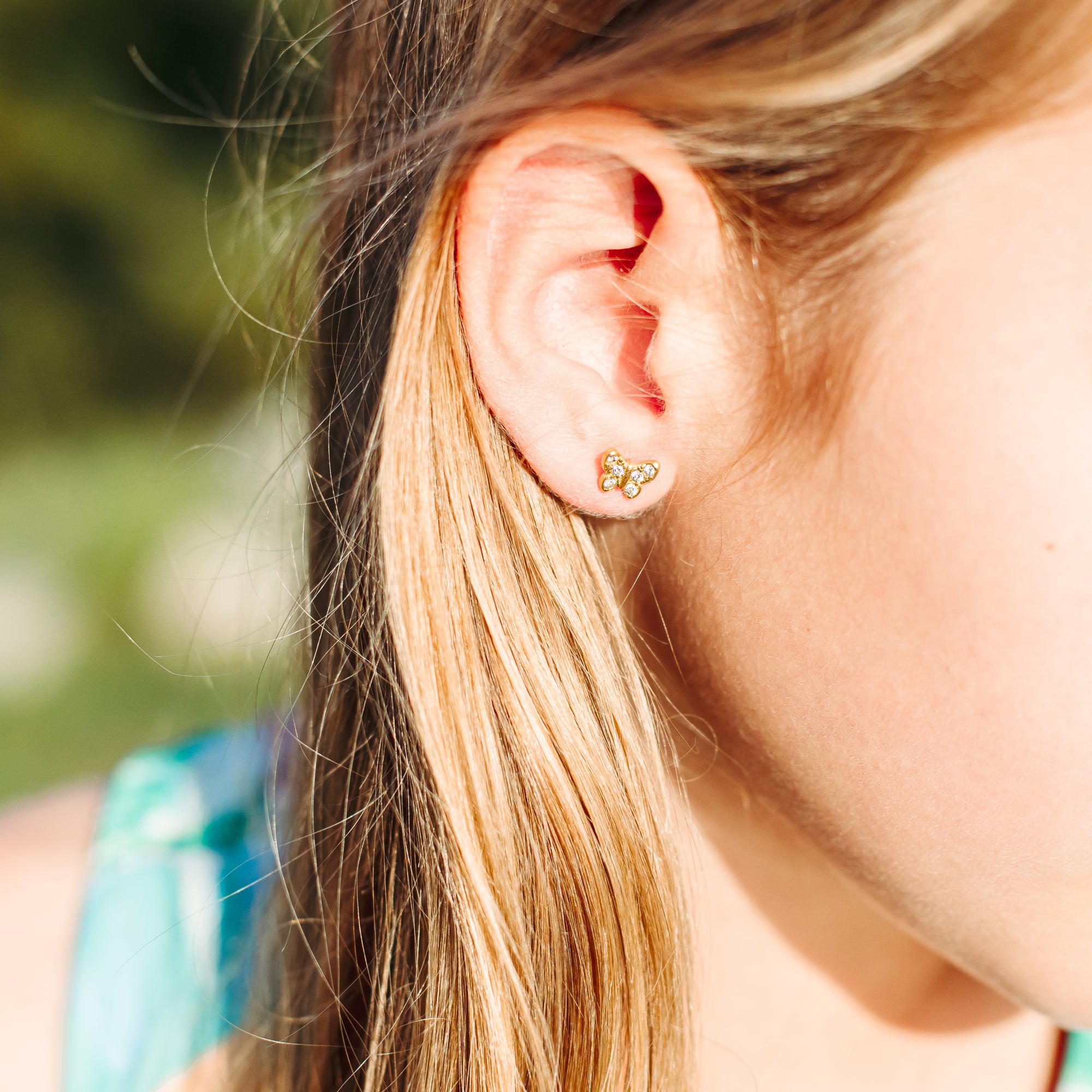 Mini gold butterfly earrings with cubic zirconia in stainless steel