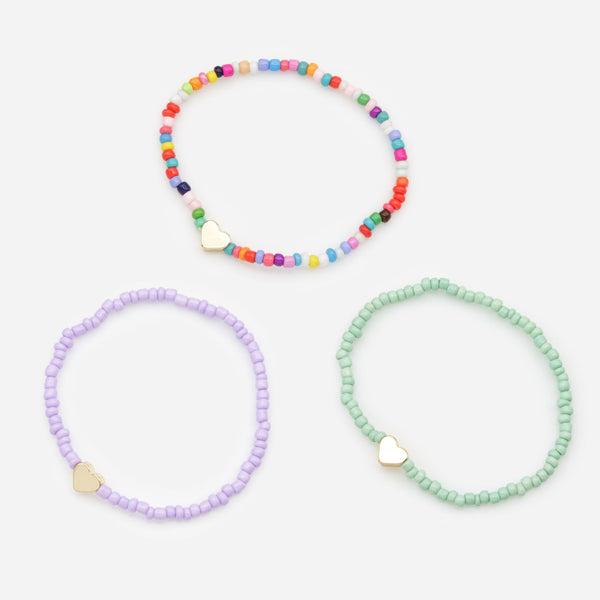 Load image into Gallery viewer, Trio of multicolored elastic bracelets with small golden hearts
