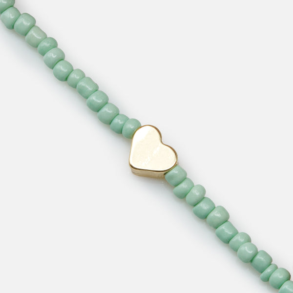 Load image into Gallery viewer, Trio of multicolored elastic bracelets with small golden hearts
