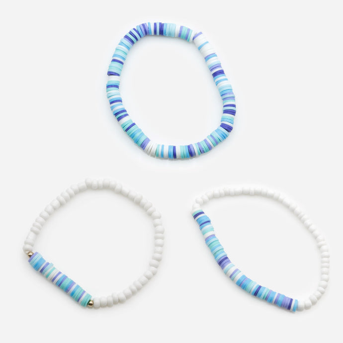 Trio of elastic bracelets with white balls and discs tones of blue