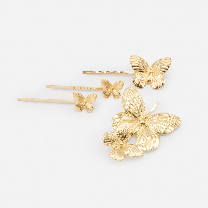 Ensemble de quatre pinces dorées papillons