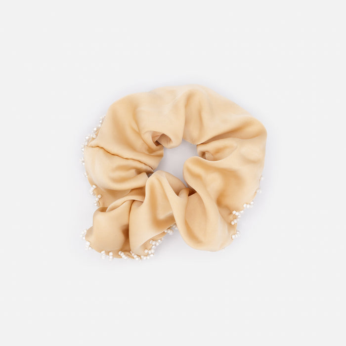 Chouchou beige avec bordure de billes blanches