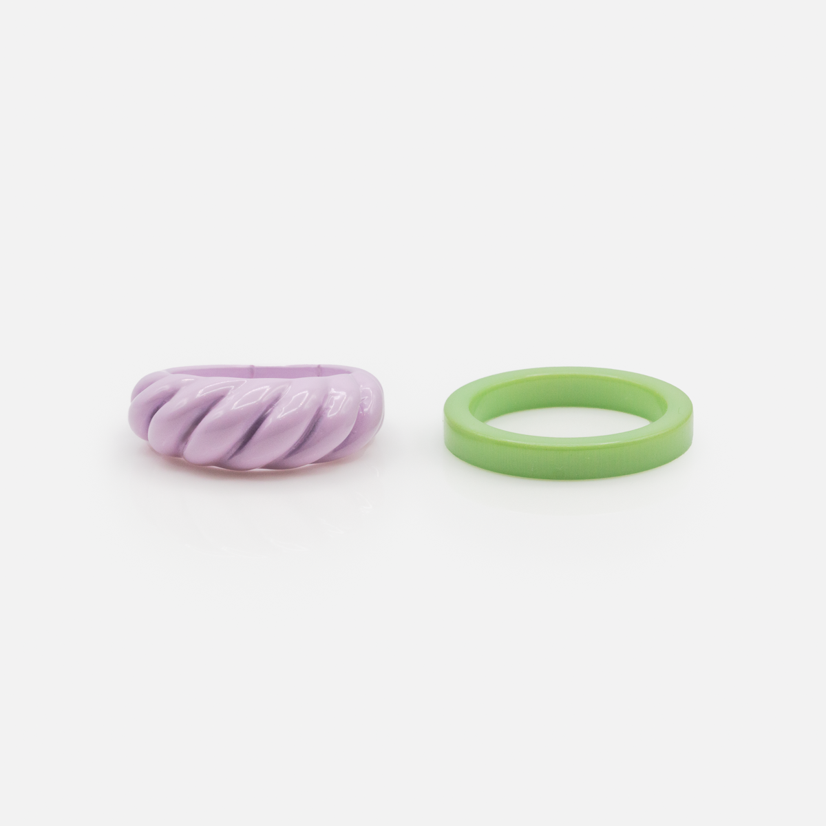 Duo of purple and green acrylic rings