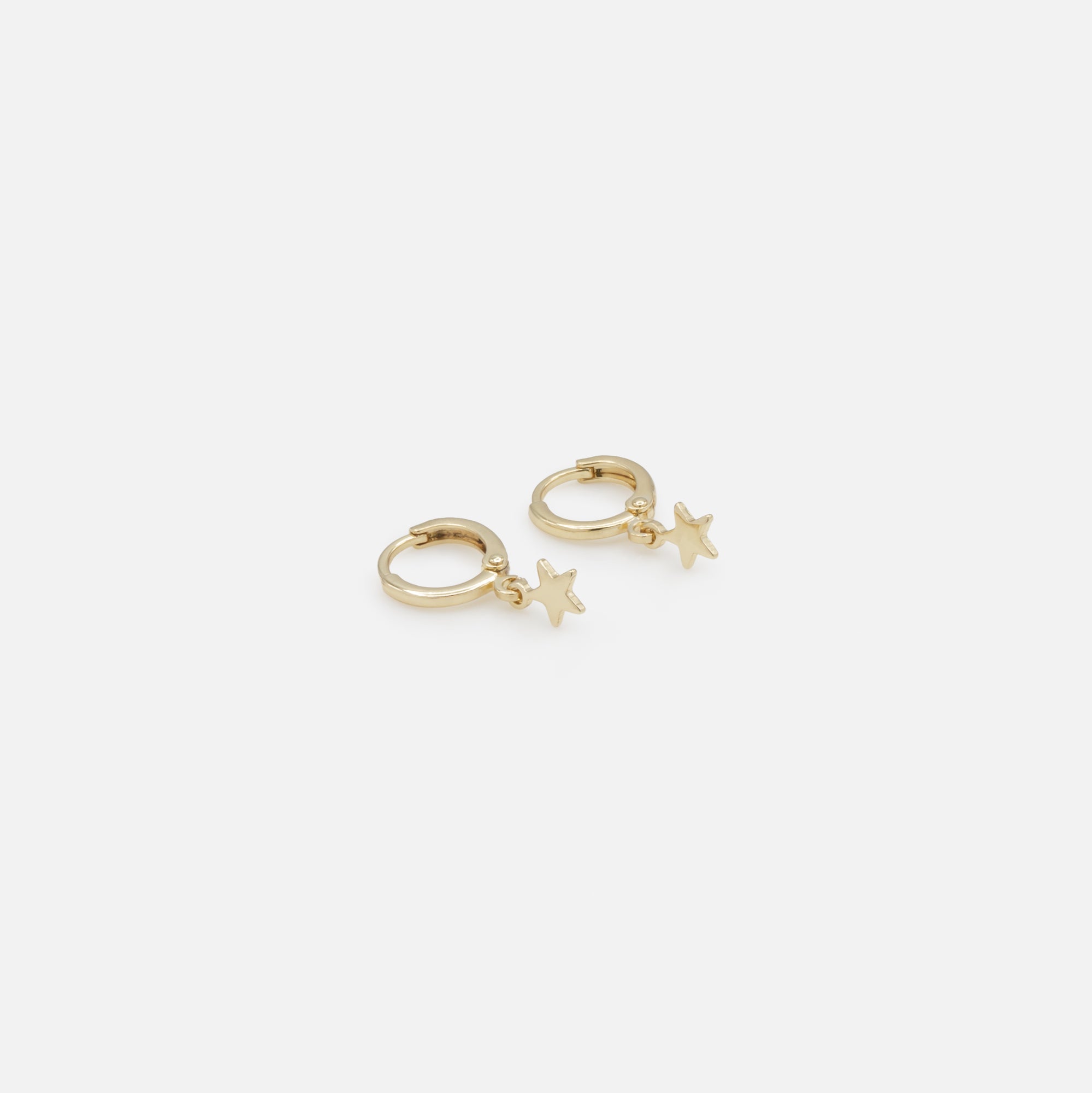 Trio of gold lightning bolt heart and star earrings