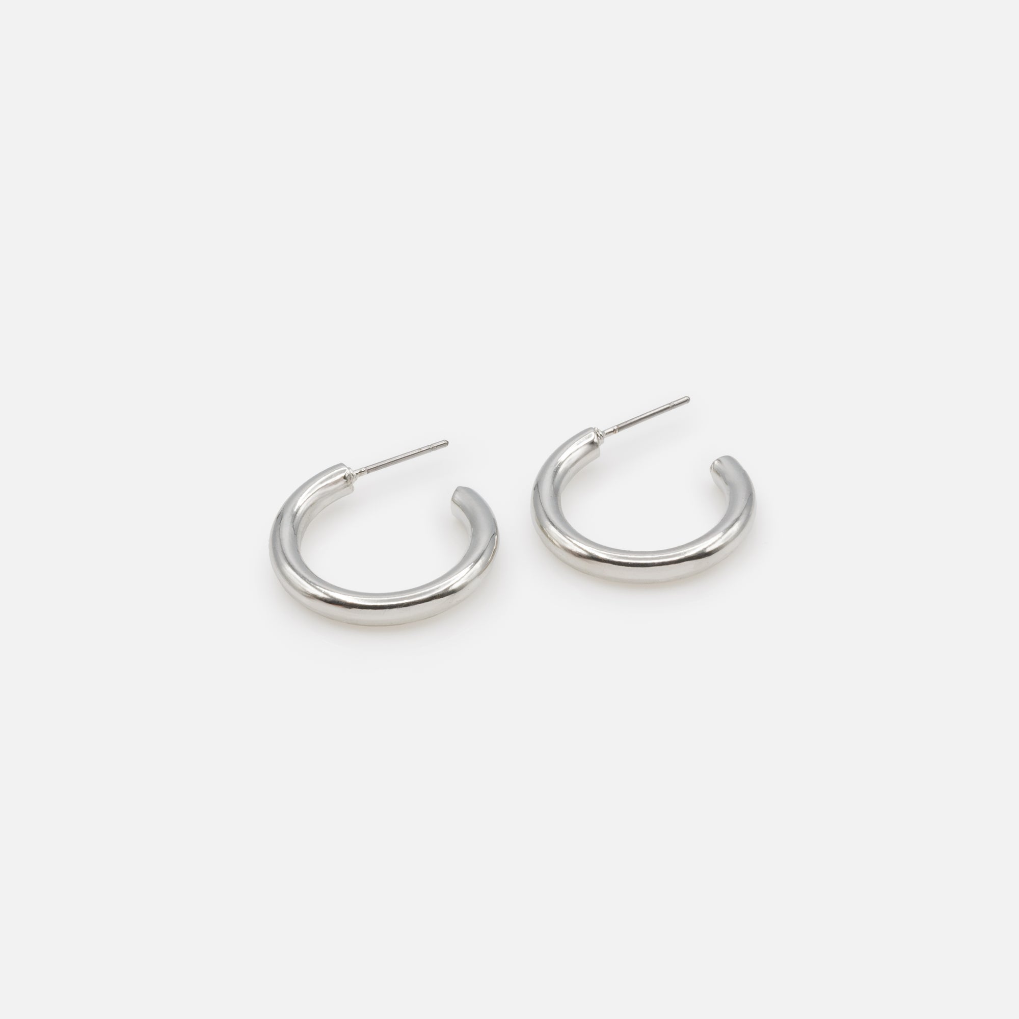 Duo of simple silver hoop and mesh earrings