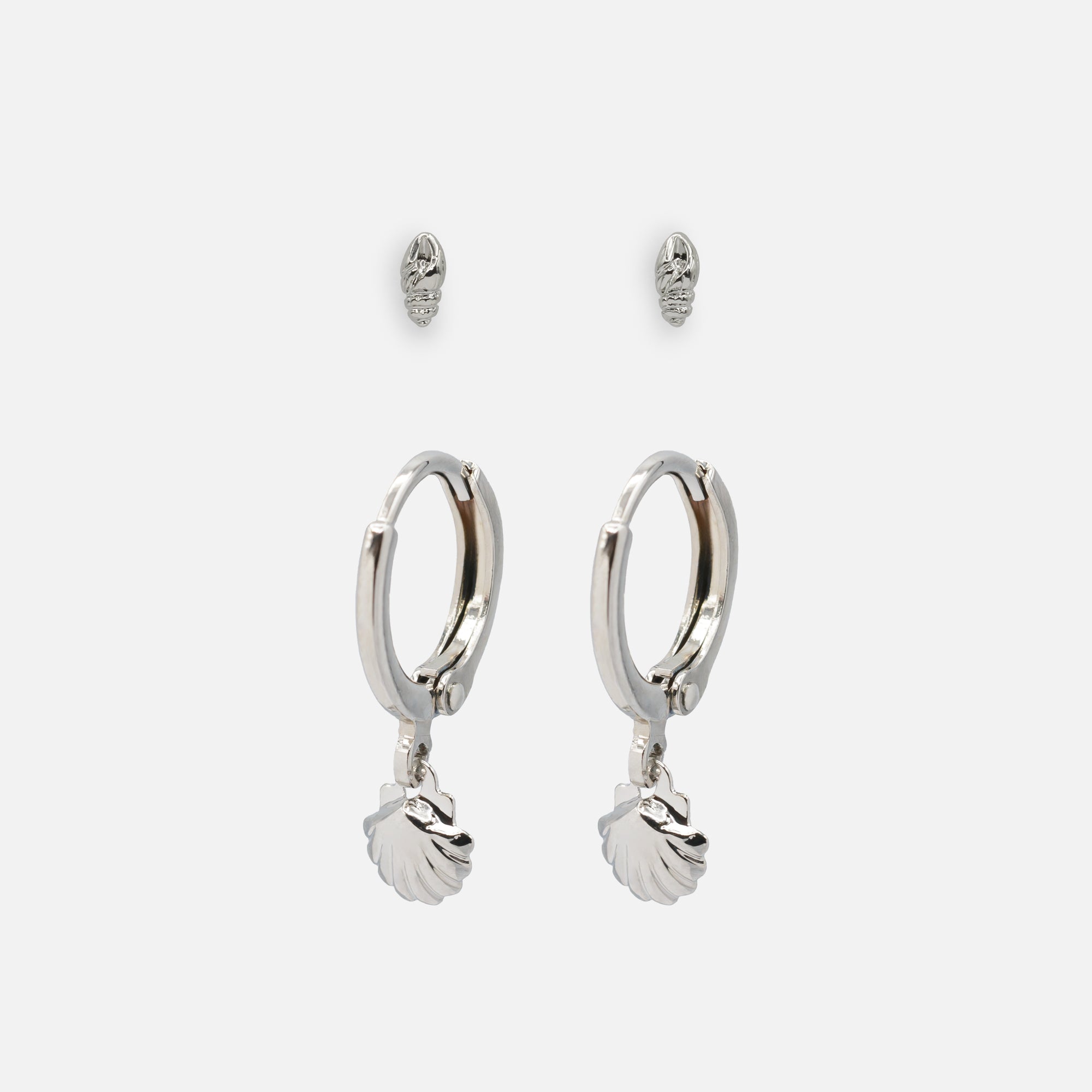 Duo of silver shell earrings